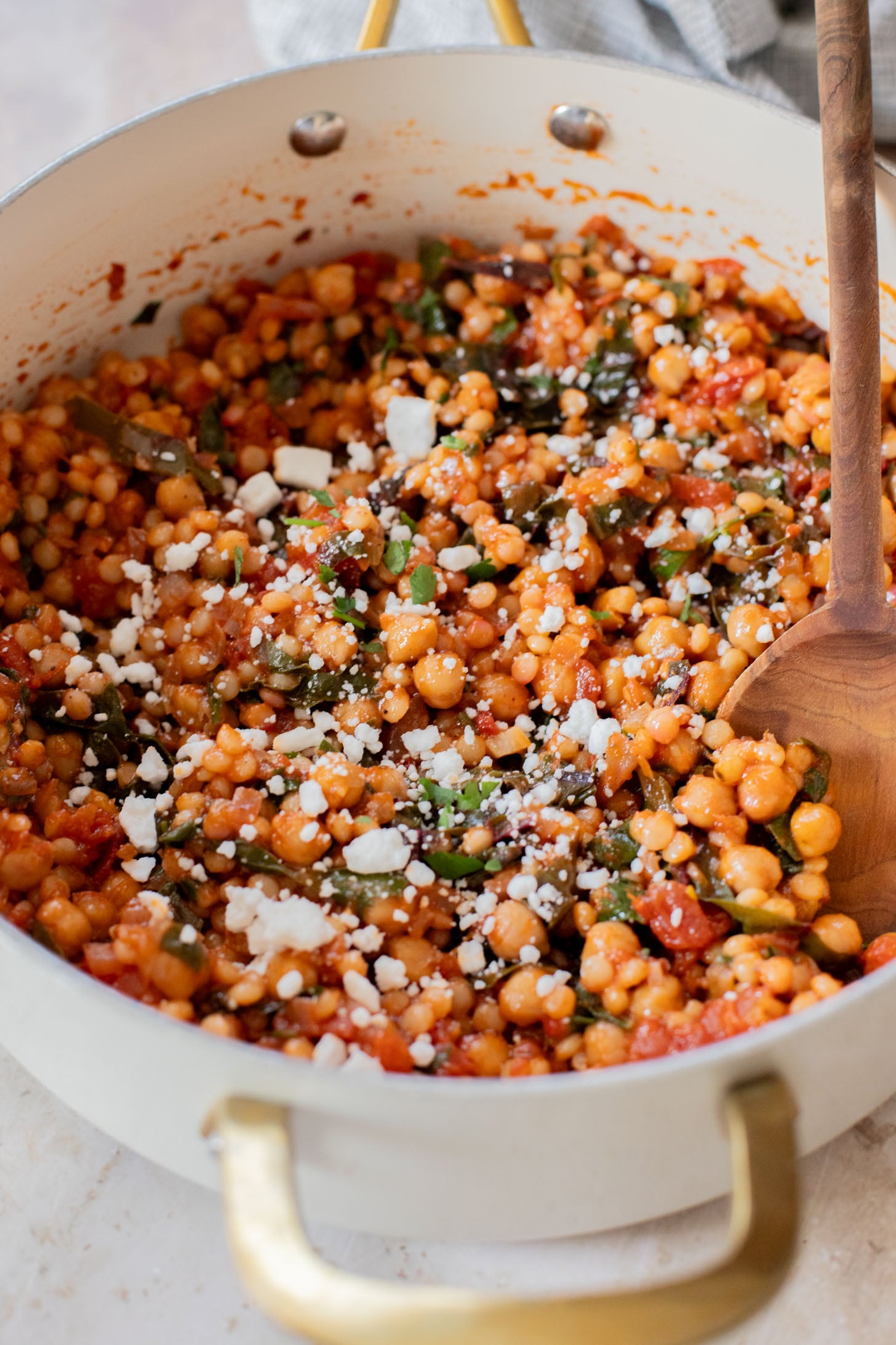 This Chickpea Couscous Skillet is a quick and healthy vegan dinner with a delicious tomato sauce, rainbow chard, pearl couscous & chickpeas | ThisSavoryVegan.com