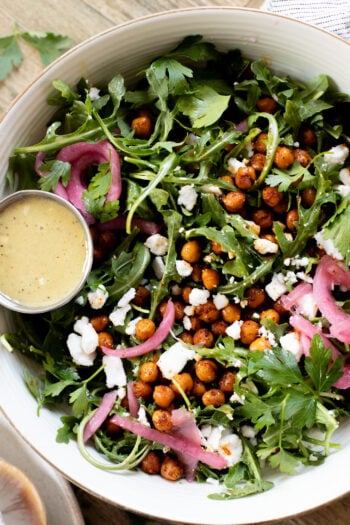 This Crispy Chickpea Arugula Salad is the perfect light, bright & delicious vegan salad. The vegan honey dijon dressing is delish | ThisSavoryVegan.com