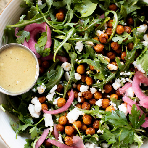 This Crispy Chickpea Arugula Salad is the perfect light, bright & delicious vegan salad. The vegan honey dijon dressing is delish | ThisSavoryVegan.com