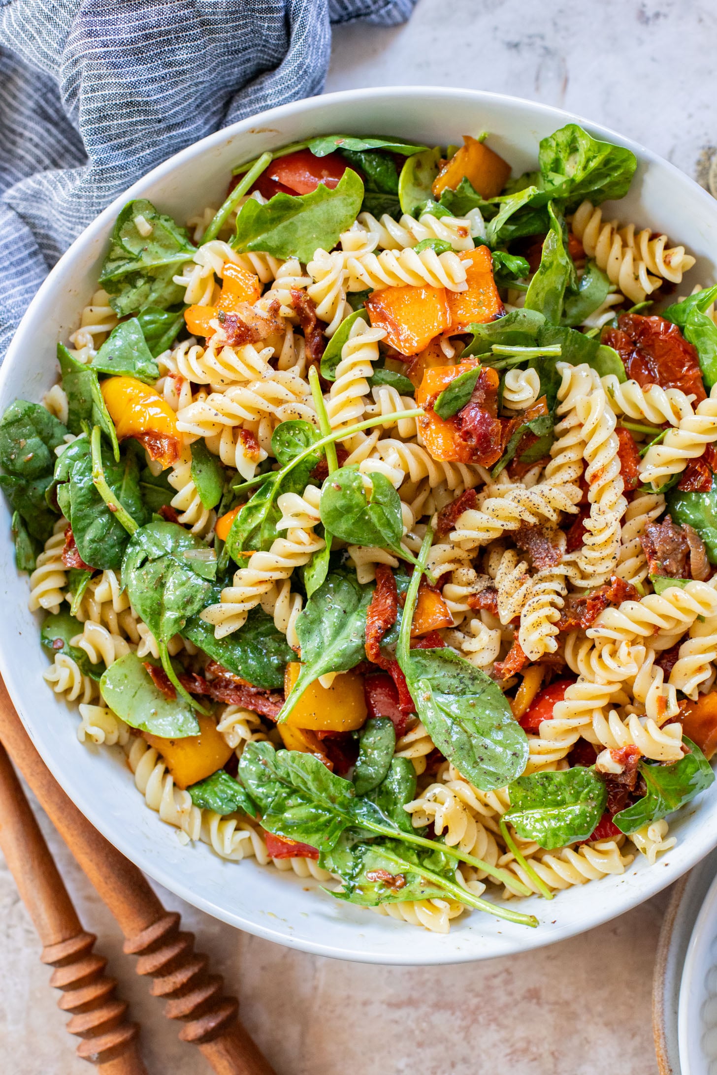 This Roasted Pepper Pasta Salad is simple but packed with flavor. Loaded with pasta, sun-dried tomatoes, roasted peppers and a light dressing | ThisSavoryVegan.com