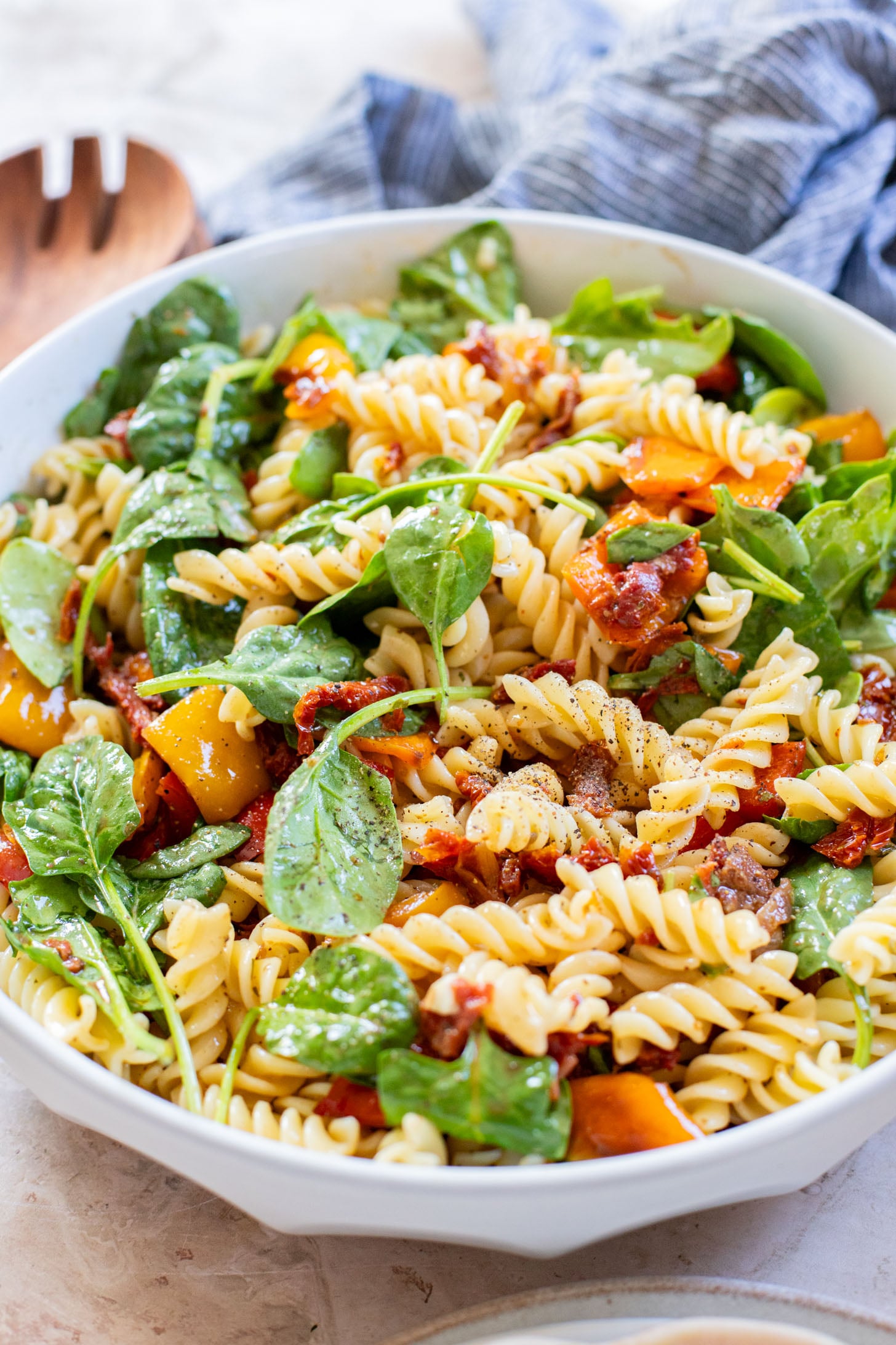 This Roasted Pepper Pasta Salad is simple but packed with flavor. Loaded with pasta, sun-dried tomatoes, roasted peppers and a light dressing | ThisSavoryVegan.com