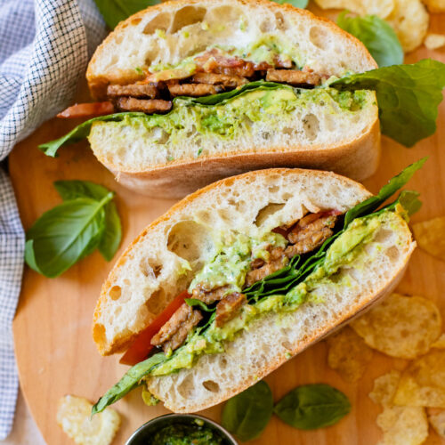 This Vegan Pesto BLT is a dream of a sandwich. Made with homemade pesto, crispy tempeh bacon on toasted ciabatta. You can't go wrong | ThisSavoryVegan.com