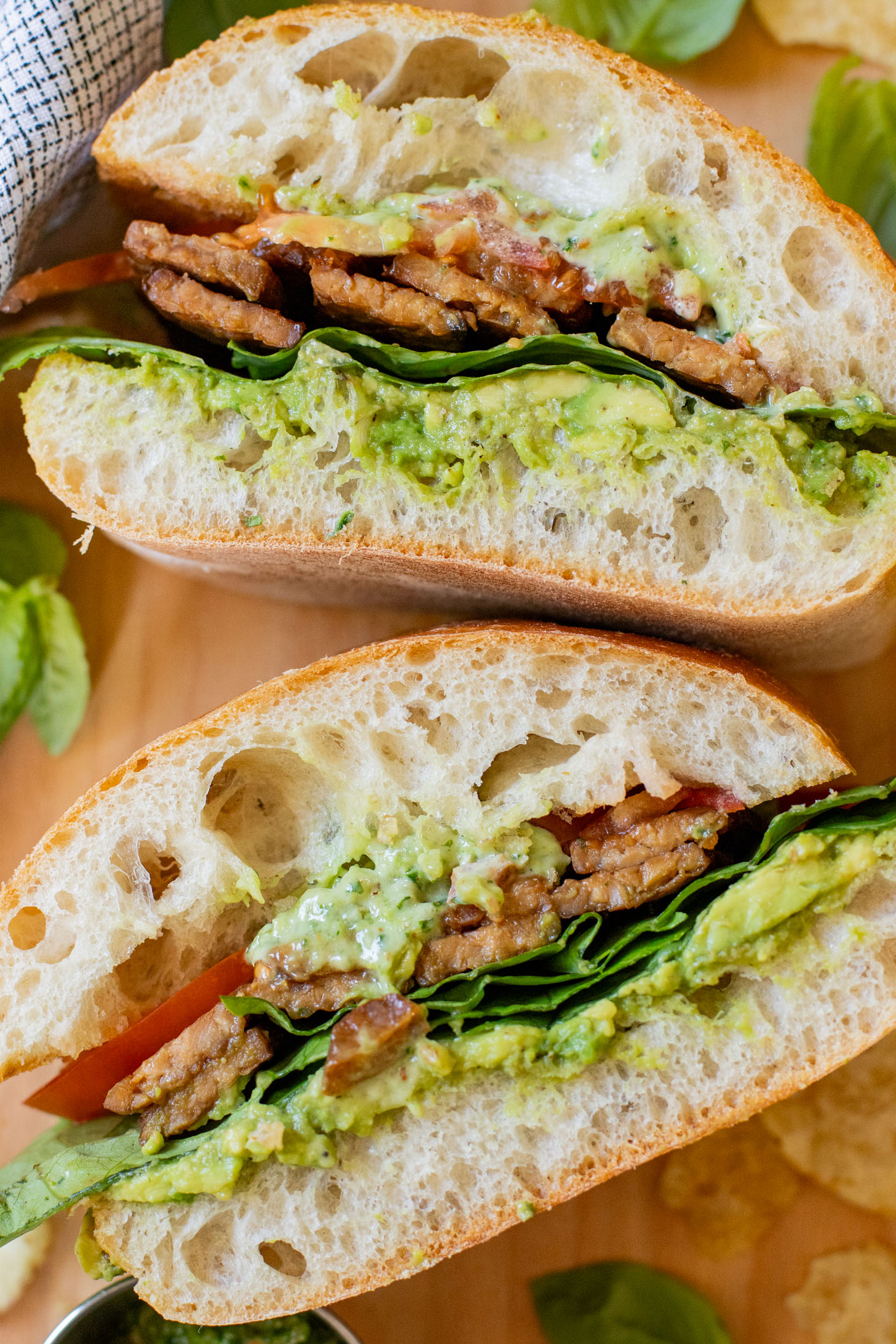 This Vegan Pesto BLT is a dream of a sandwich. Made with homemade pesto, crispy tempeh bacon on toasted ciabatta. You can't go wrong | ThisSavoryVegan.com