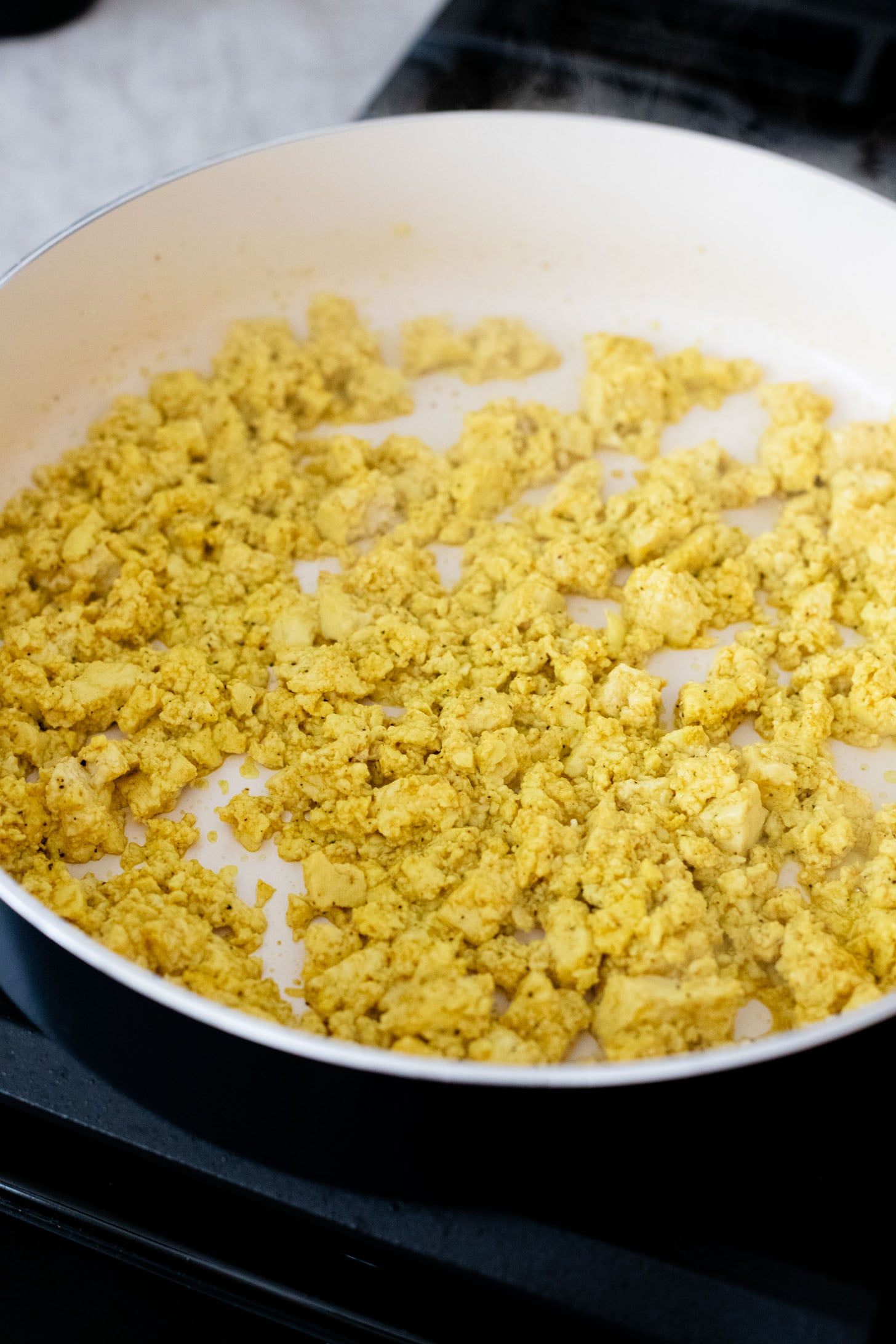 These Tofu Scramble Breakfast Wraps are a play on the Starbucks feta egg white wrap - but made dairy-free & with tofu | ThisSavoryVegan.com