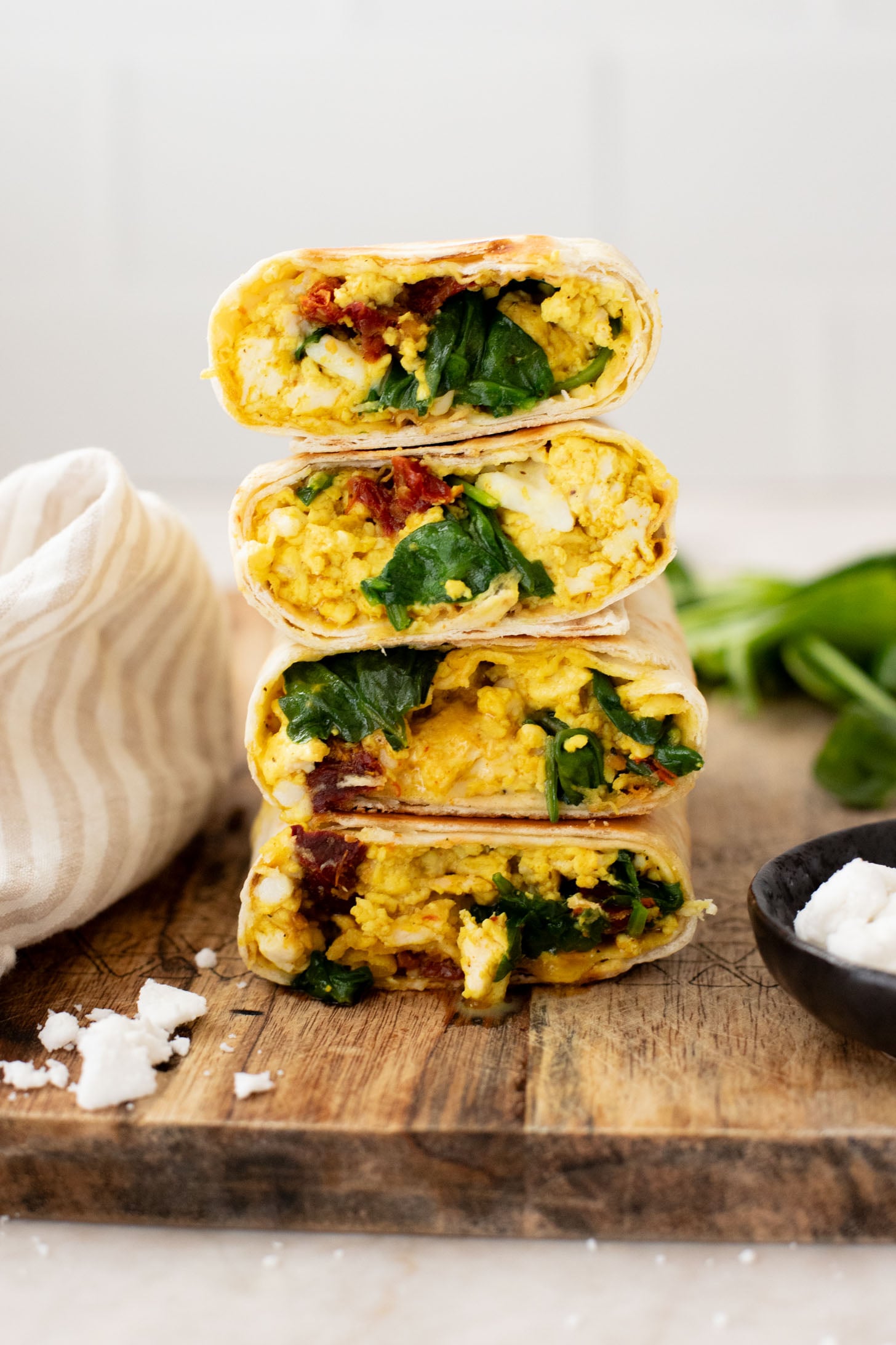 These Tofu Scramble Breakfast Wraps are a play on the Starbucks feta egg white wrap - but made dairy-free & with tofu | ThisSavoryVegan.com