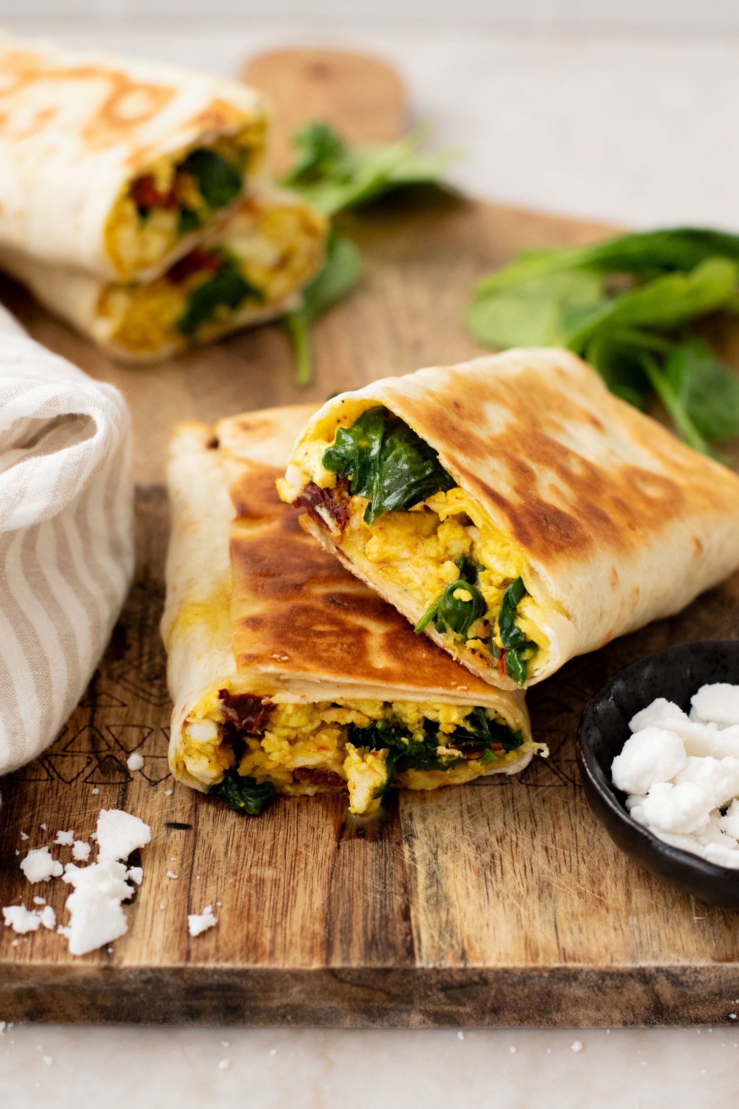 These Tofu Scramble Breakfast Wraps are a play on the Starbucks feta egg white wrap - but made dairy-free & with tofu | ThisSavoryVegan.com
