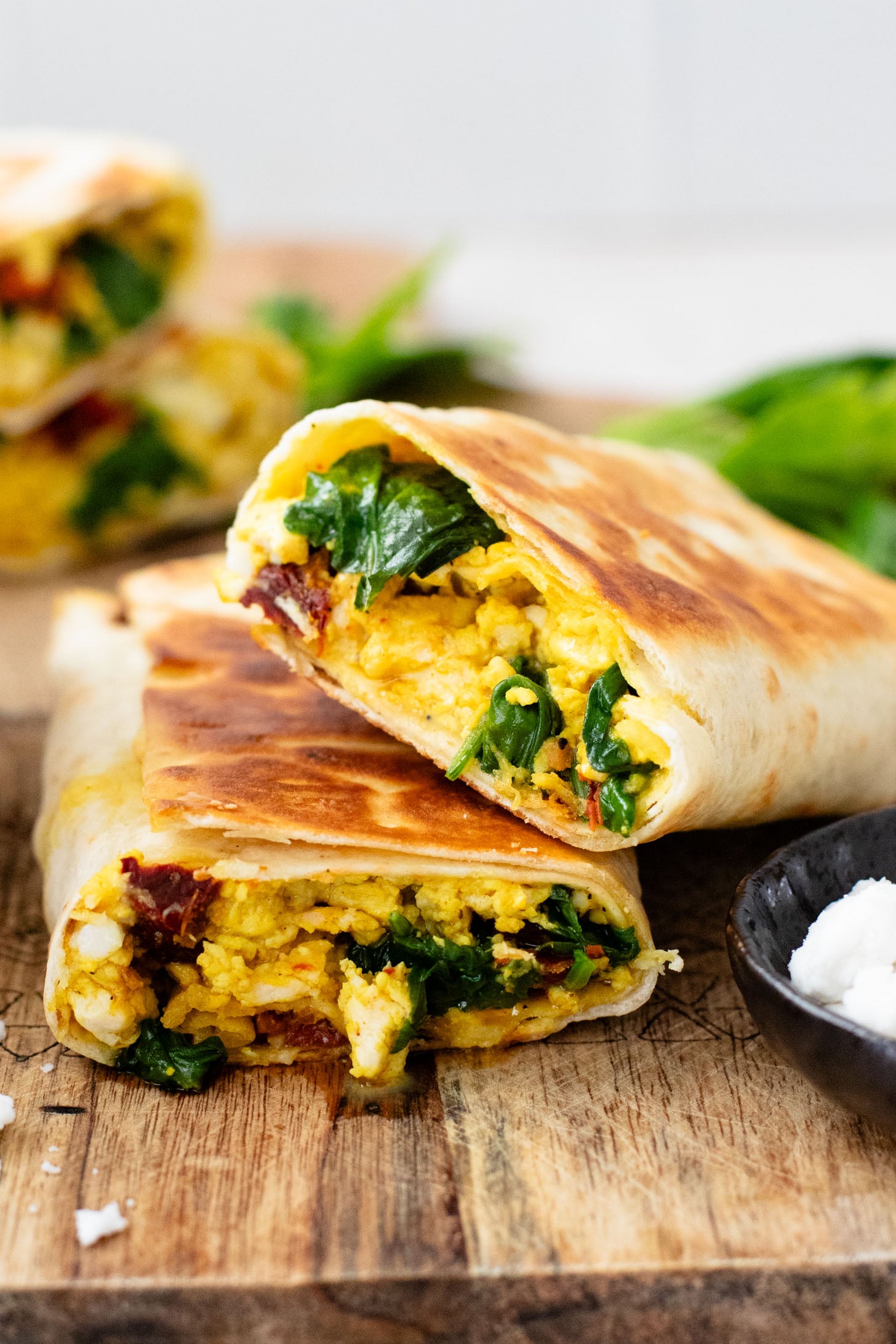 These Tofu Scramble Breakfast Wraps are a play on the Starbucks feta egg white wrap - but made dairy-free & with tofu | ThisSavoryVegan.com