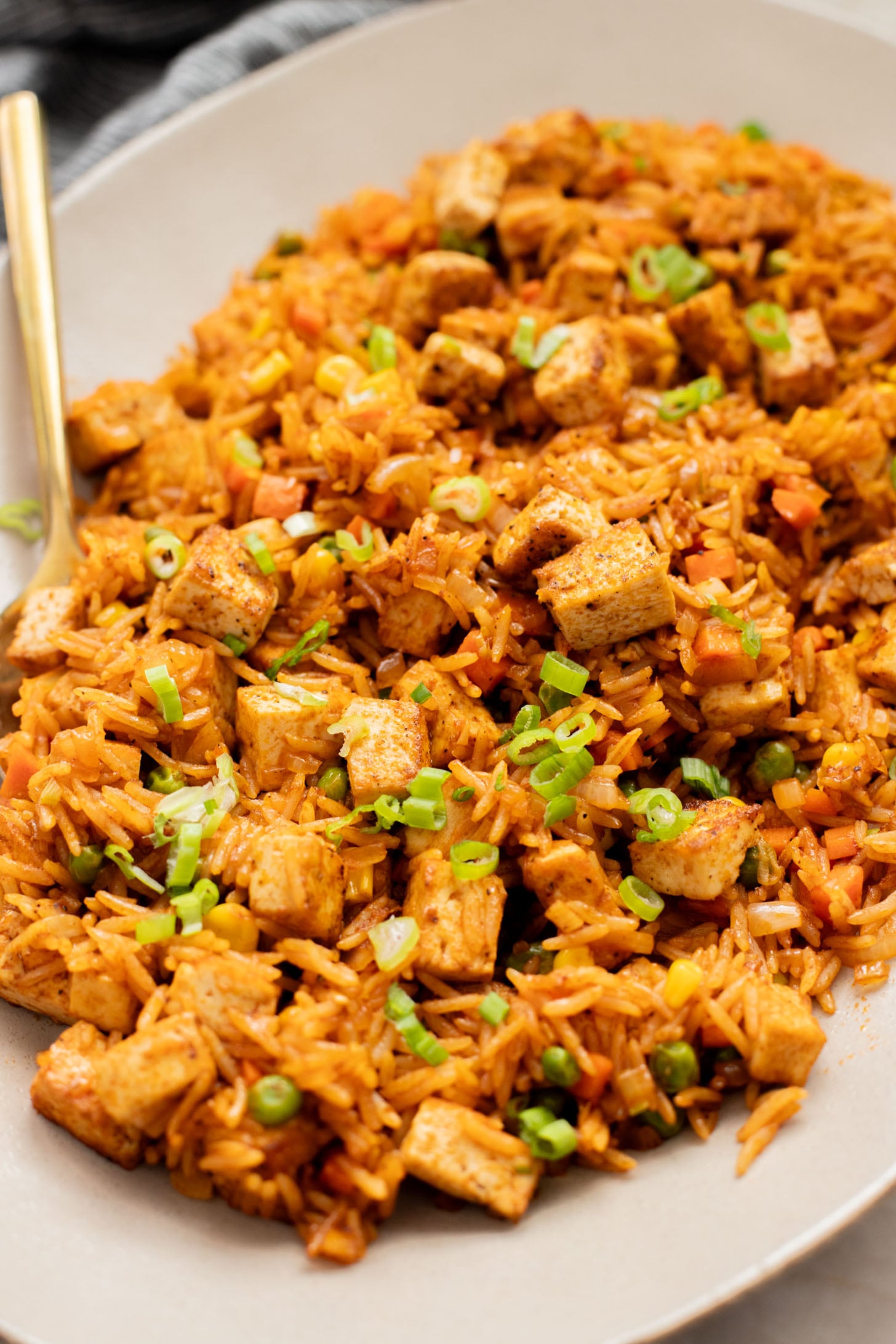 This BBQ Tofu Fried Rice is better than take-out and the perfect weeknight dinner. Crispy tofu, veggies, leftover rice & BBQ sauce is the best mix | ThisSavoryVegan.com