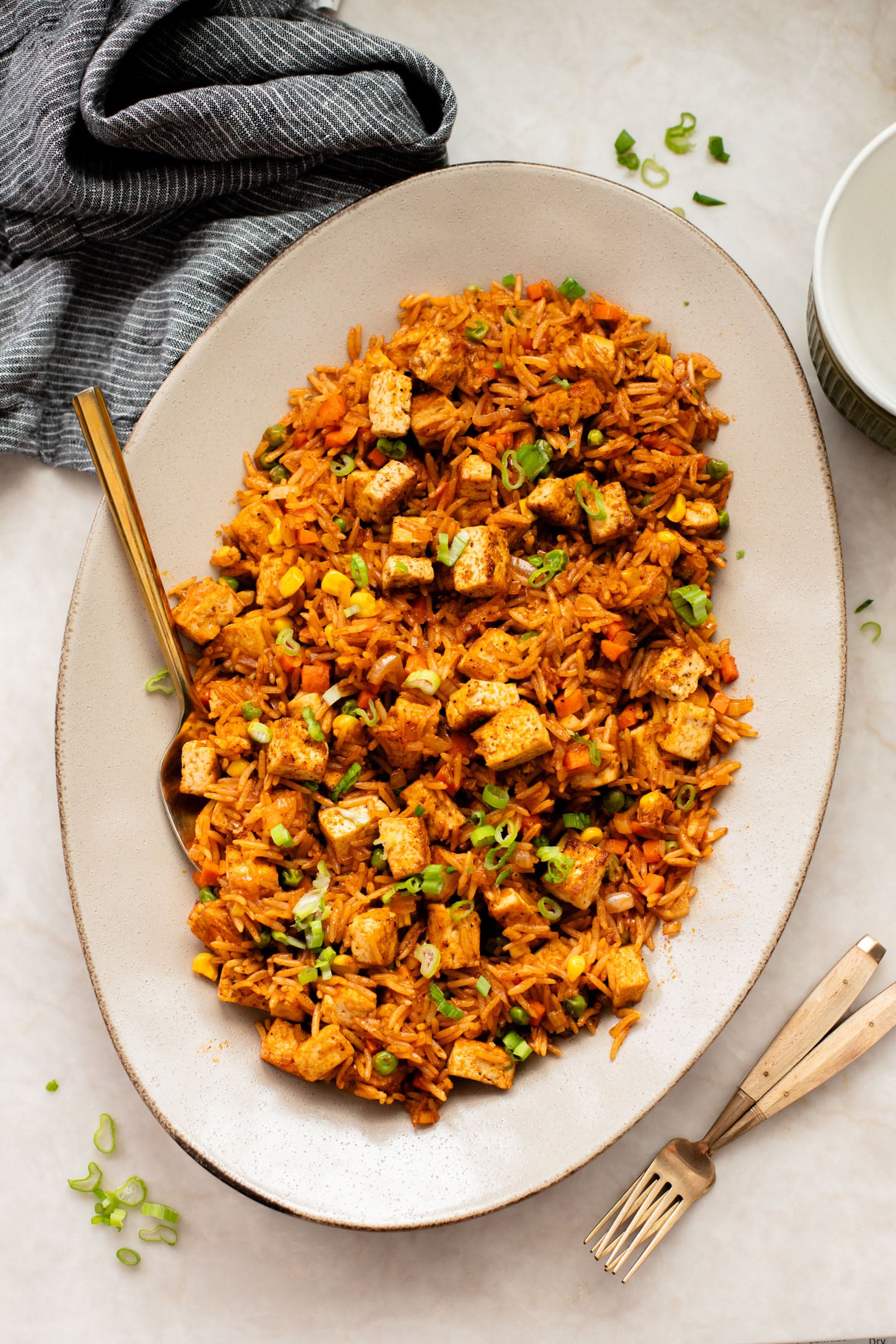 This BBQ Tofu Fried Rice is better than take-out and the perfect weeknight dinner. Crispy tofu, veggies, leftover rice & BBQ sauce is the best mix | ThisSavoryVegan.com