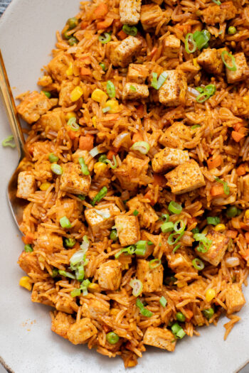 This BBQ Tofu Fried Rice is better than take-out and the perfect weeknight dinner. Crispy tofu, veggies, leftover rice & BBQ sauce is the best mix | ThisSavoryVegan.com