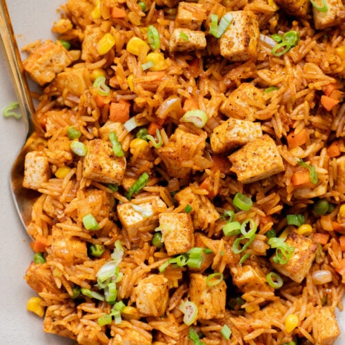 This BBQ Tofu Fried Rice is better than take-out and the perfect weeknight dinner. Crispy tofu, veggies, leftover rice & BBQ sauce is the best mix | ThisSavoryVegan.com