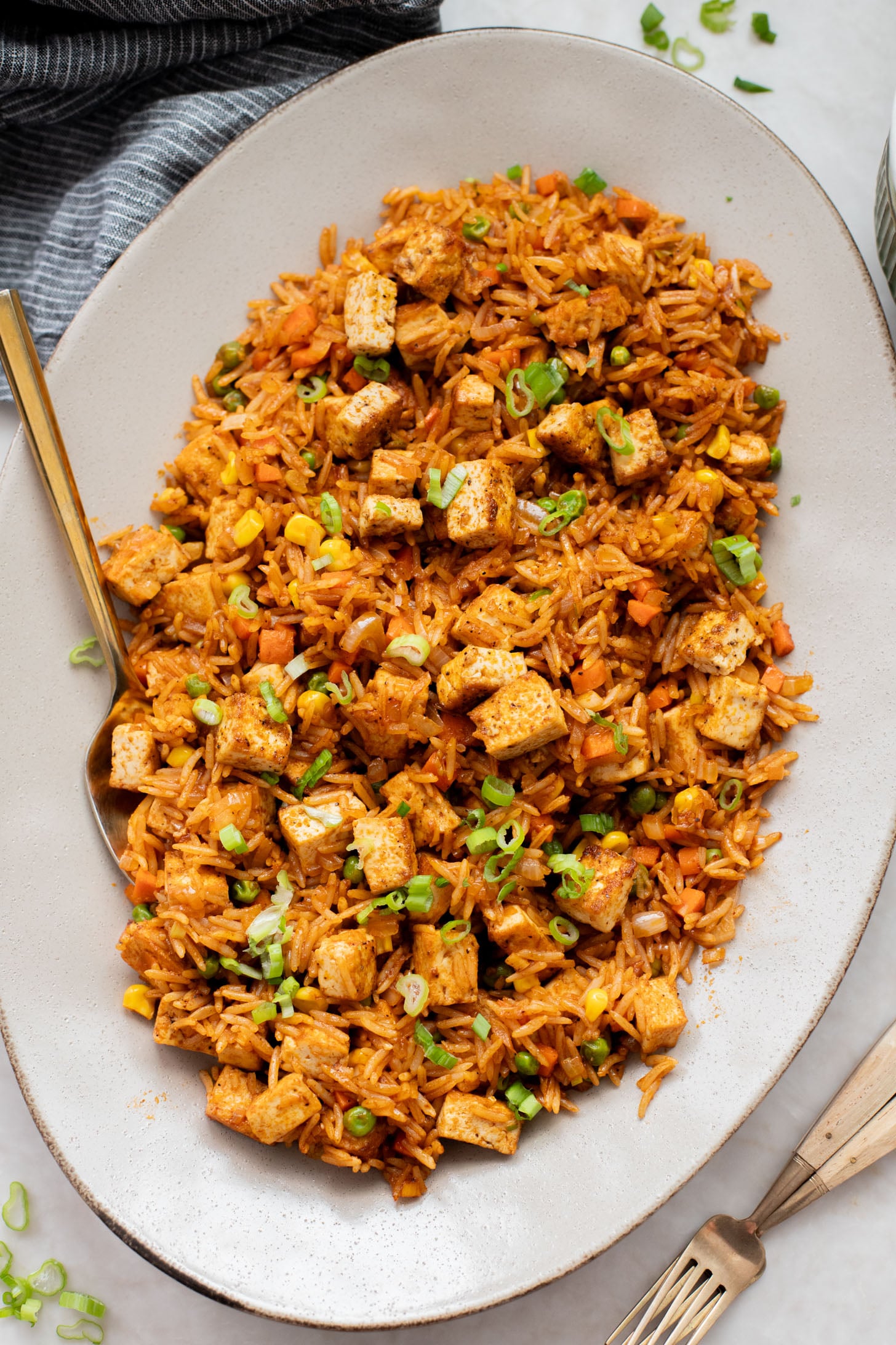 This BBQ Tofu Fried Rice is better than take-out and the perfect weeknight dinner. Crispy tofu, veggies, leftover rice & BBQ sauce is the best mix | ThisSavoryVegan.com