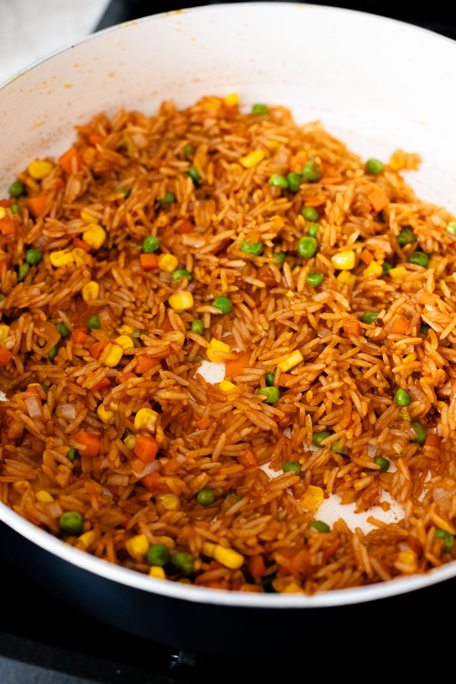 This BBQ Tofu Fried Rice is better than take-out and the perfect weeknight dinner. Crispy tofu, veggies, leftover rice & BBQ sauce is the best mix | ThisSavoryVegan.com