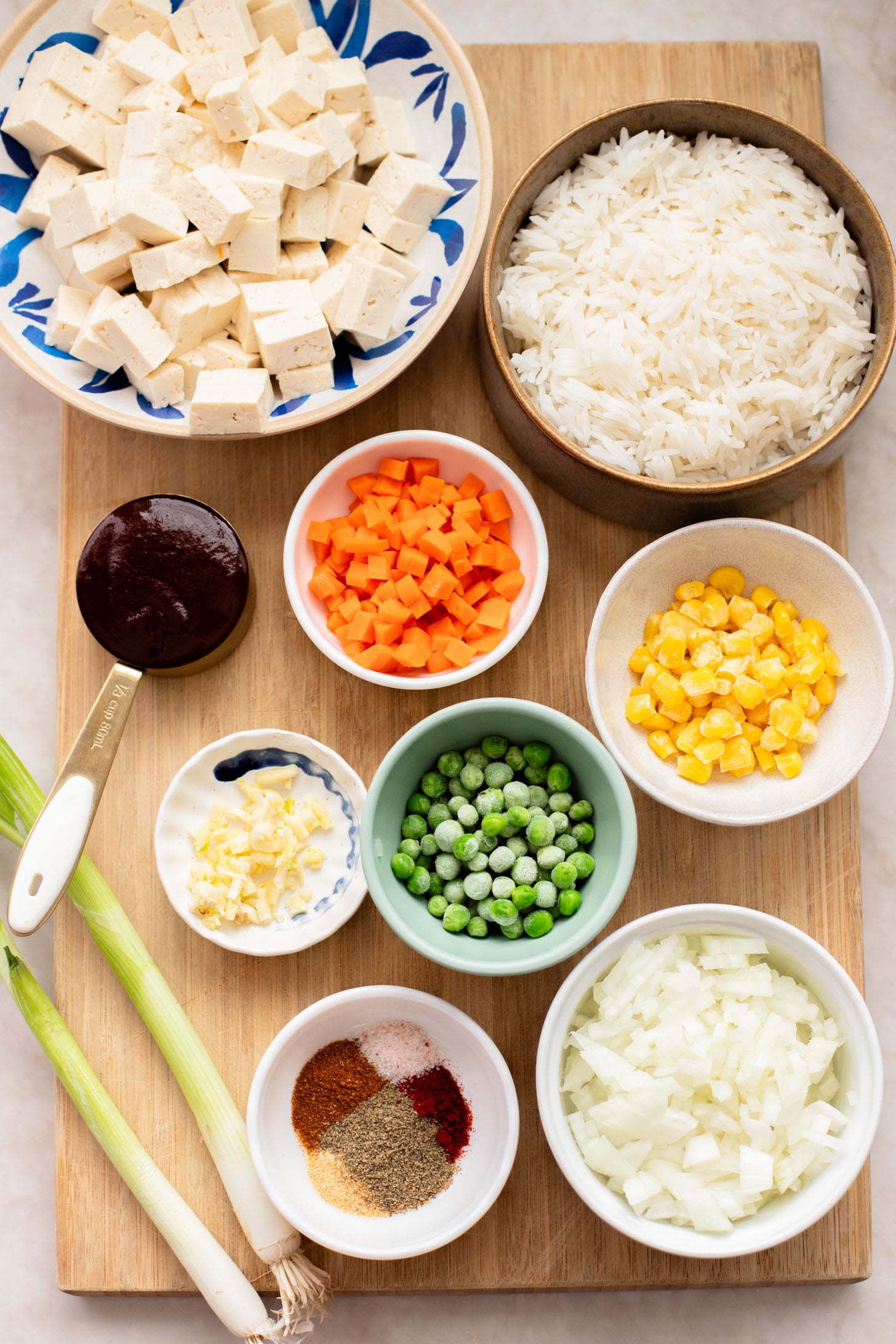 This BBQ Tofu Fried Rice is better than take-out and the perfect weeknight dinner. Crispy tofu, veggies, leftover rice & BBQ sauce is the best mix | ThisSavoryVegan.com