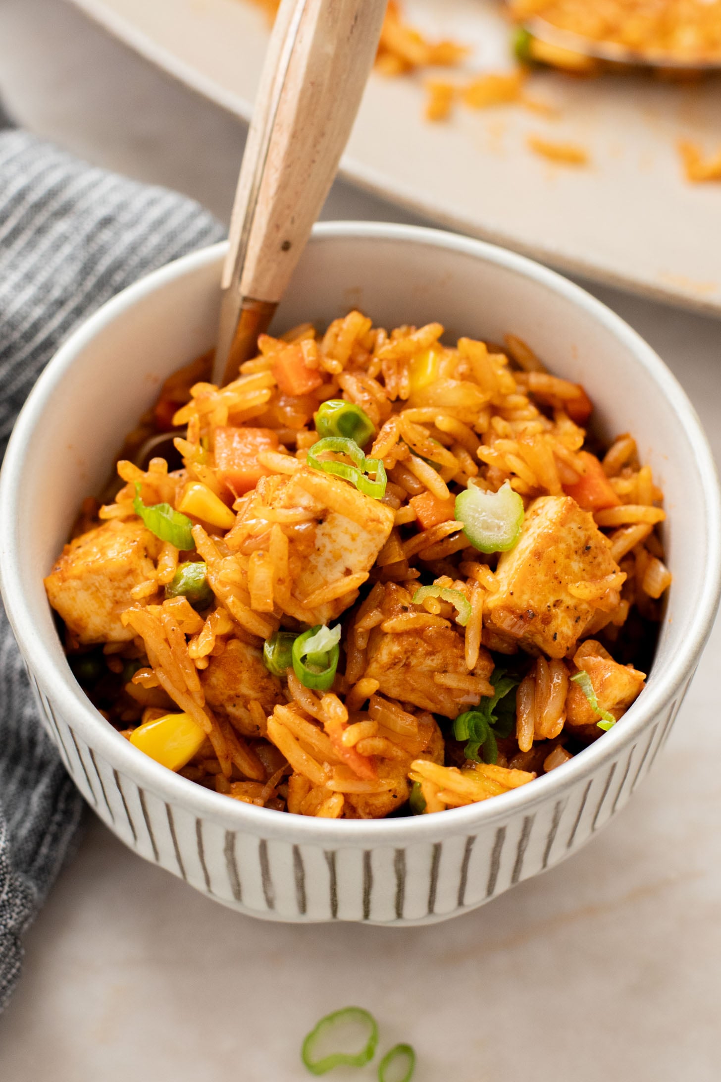 This BBQ Tofu Fried Rice is better than take-out and the perfect weeknight dinner. Crispy tofu, veggies, leftover rice & BBQ sauce is the best mix | ThisSavoryVegan.com