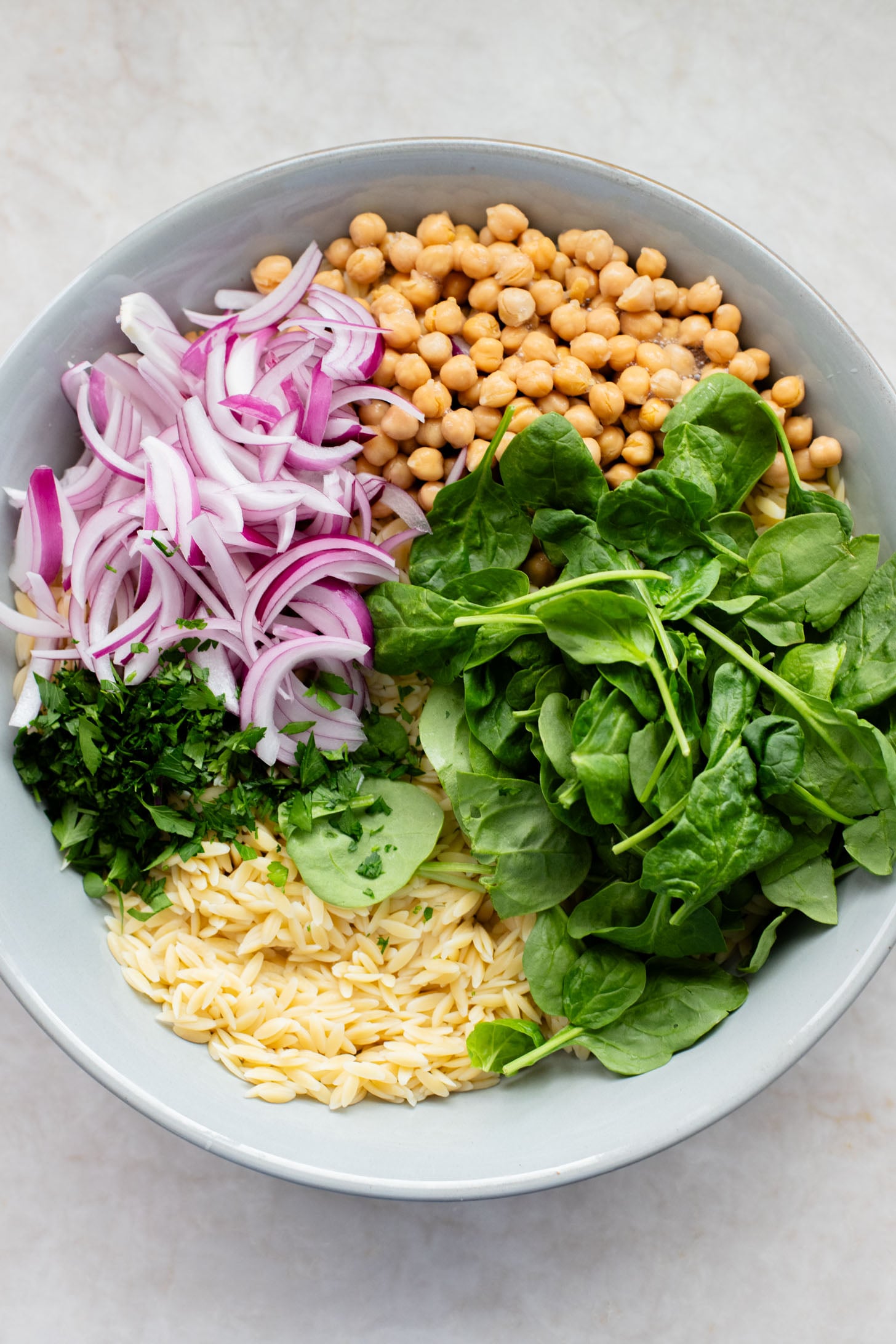 This Lemon Orzo Pasta Salad has light, fresh flavors, plus plenty of greens. The perfect vegan pasta salad for the warmer months | ThisSavoryVegan.com