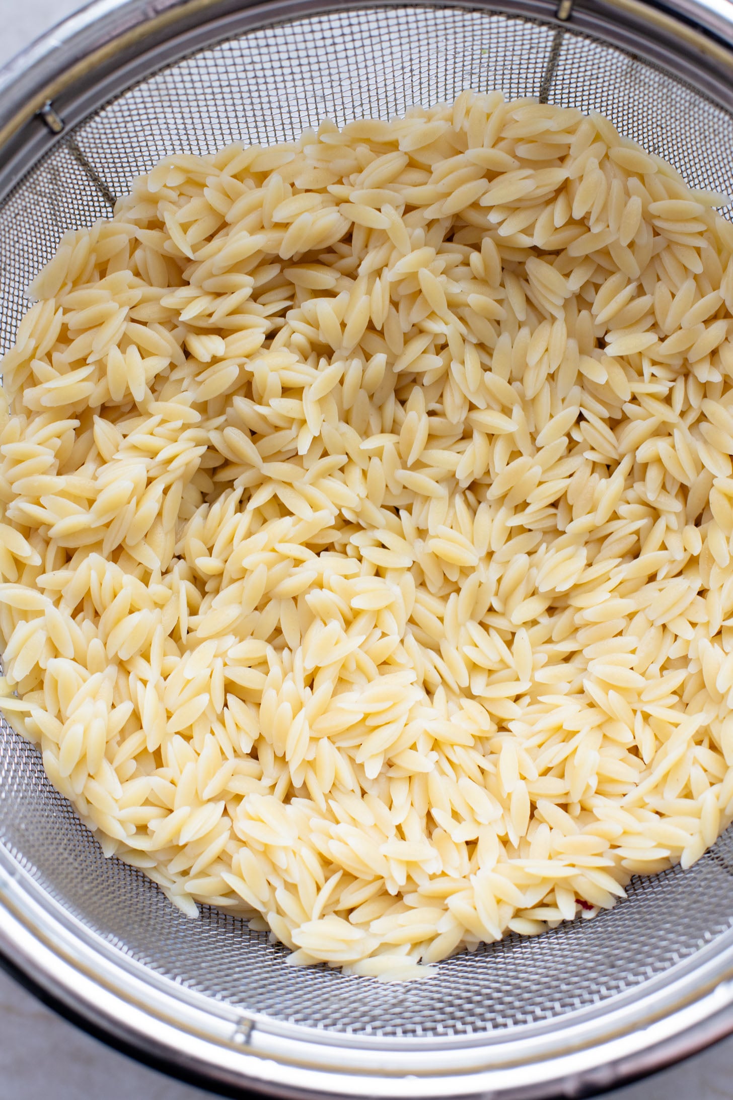 This Lemon Orzo Pasta Salad has light, fresh flavors, plus plenty of greens. The perfect vegan pasta salad for the warmer months | ThisSavoryVegan.com