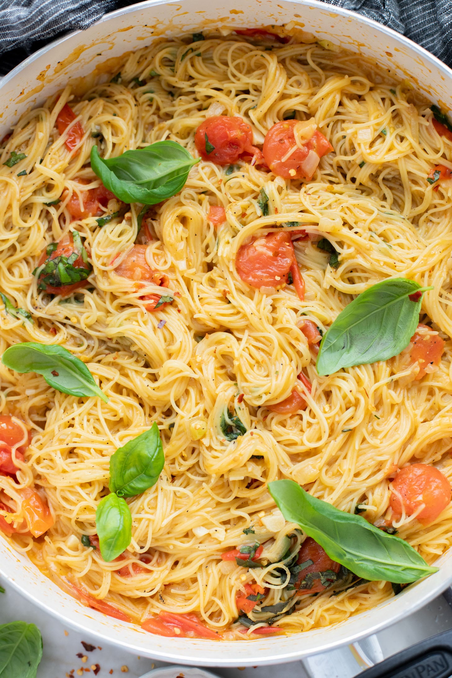 This Summer Capellini is a one-pot vegan pasta dish that is simple but packed with flavor from cherry tomatoes & garlic | ThisSavoryVegan.com