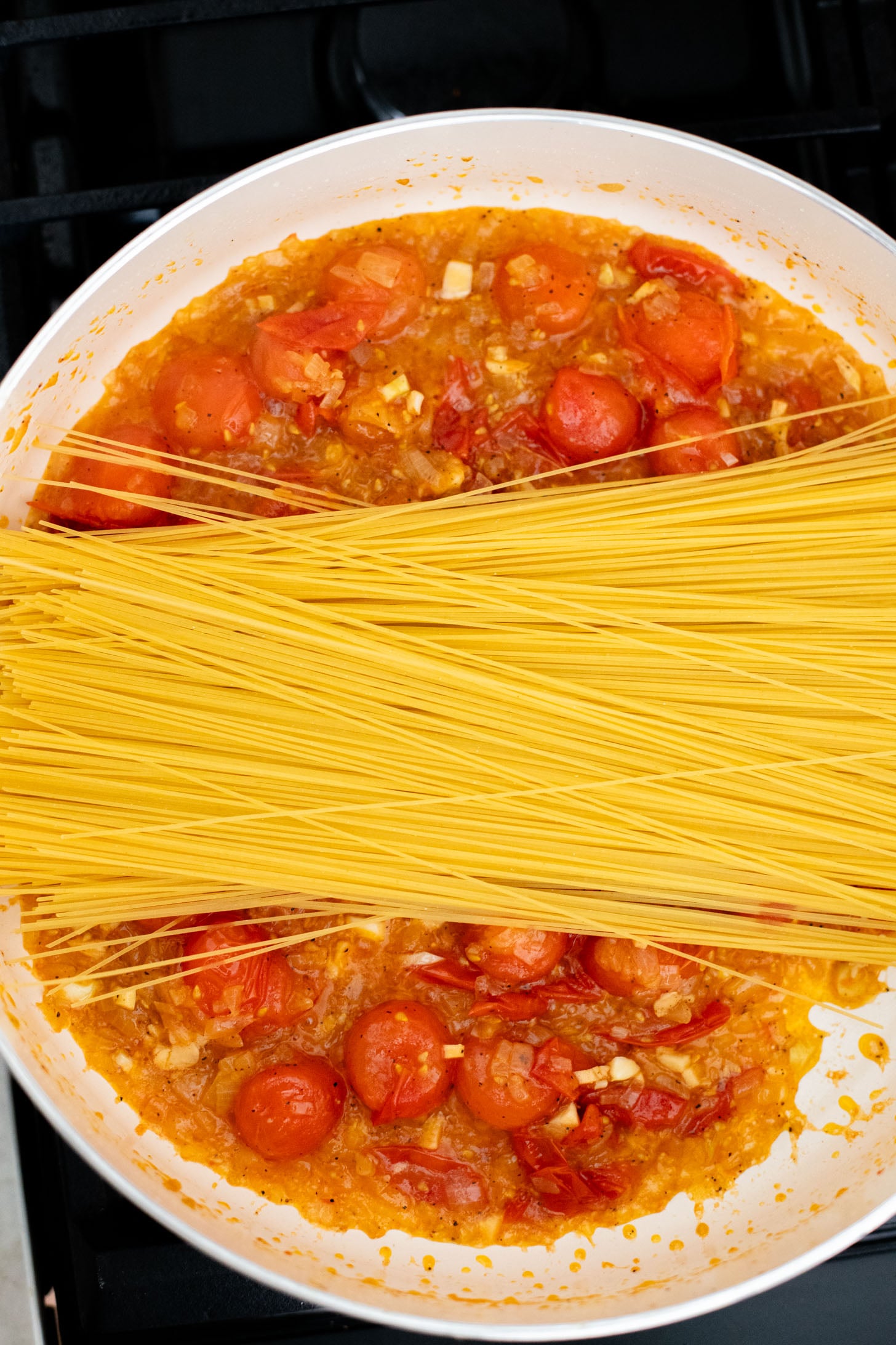 This Summer Capellini is a one-pot vegan pasta dish that is simple but packed with flavor from cherry tomatoes & garlic | ThisSavoryVegan.com