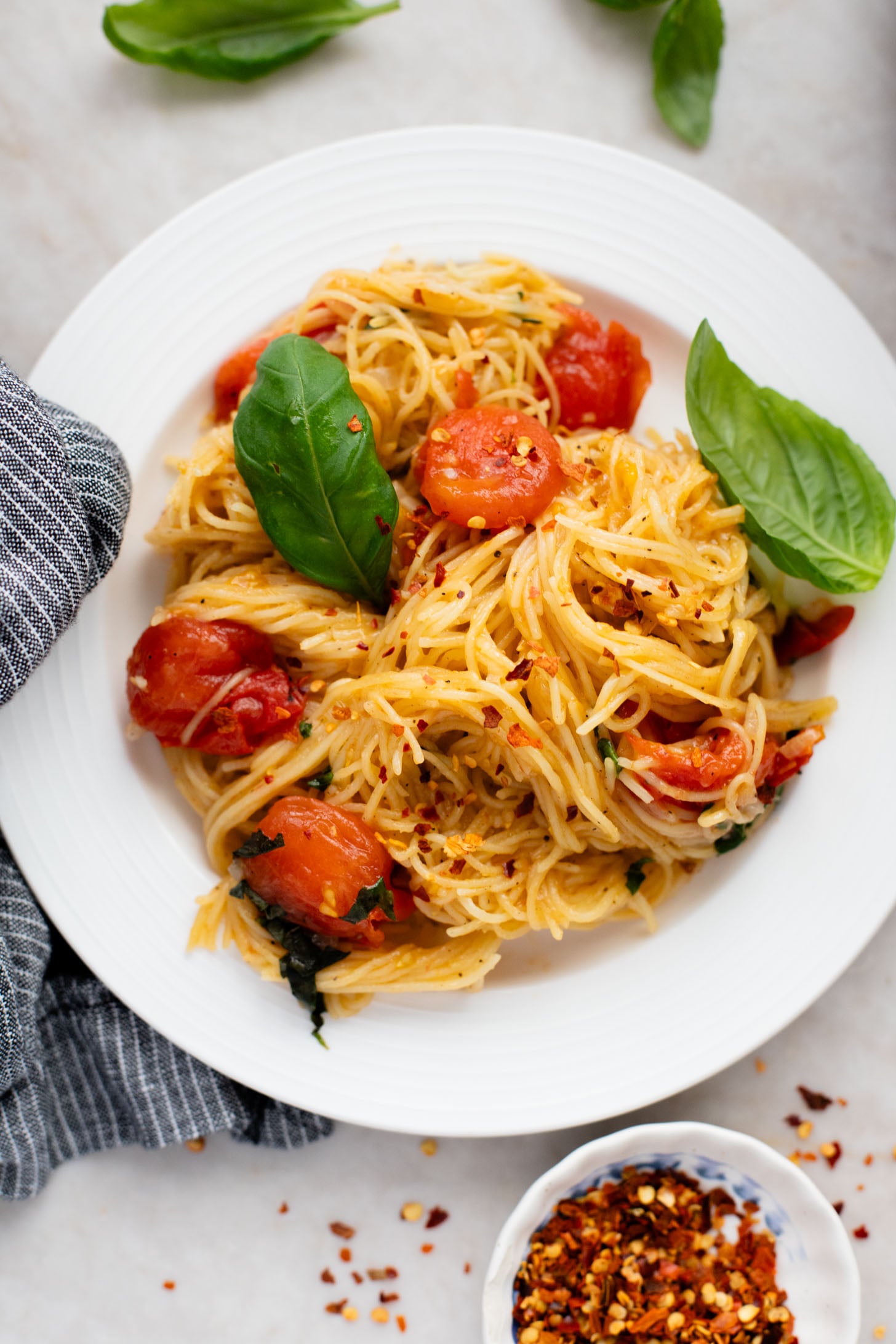 This Summer Capellini is a one-pot vegan pasta dish that is simple but packed with flavor from cherry tomatoes & garlic | ThisSavoryVegan.com