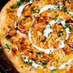 This Vegan Buffalo Chicken Pizza has the perfect amount of spice, crunch and tang. The vegan ranch mellows the spice for the perfect bite | ThisSavoryVegan.com