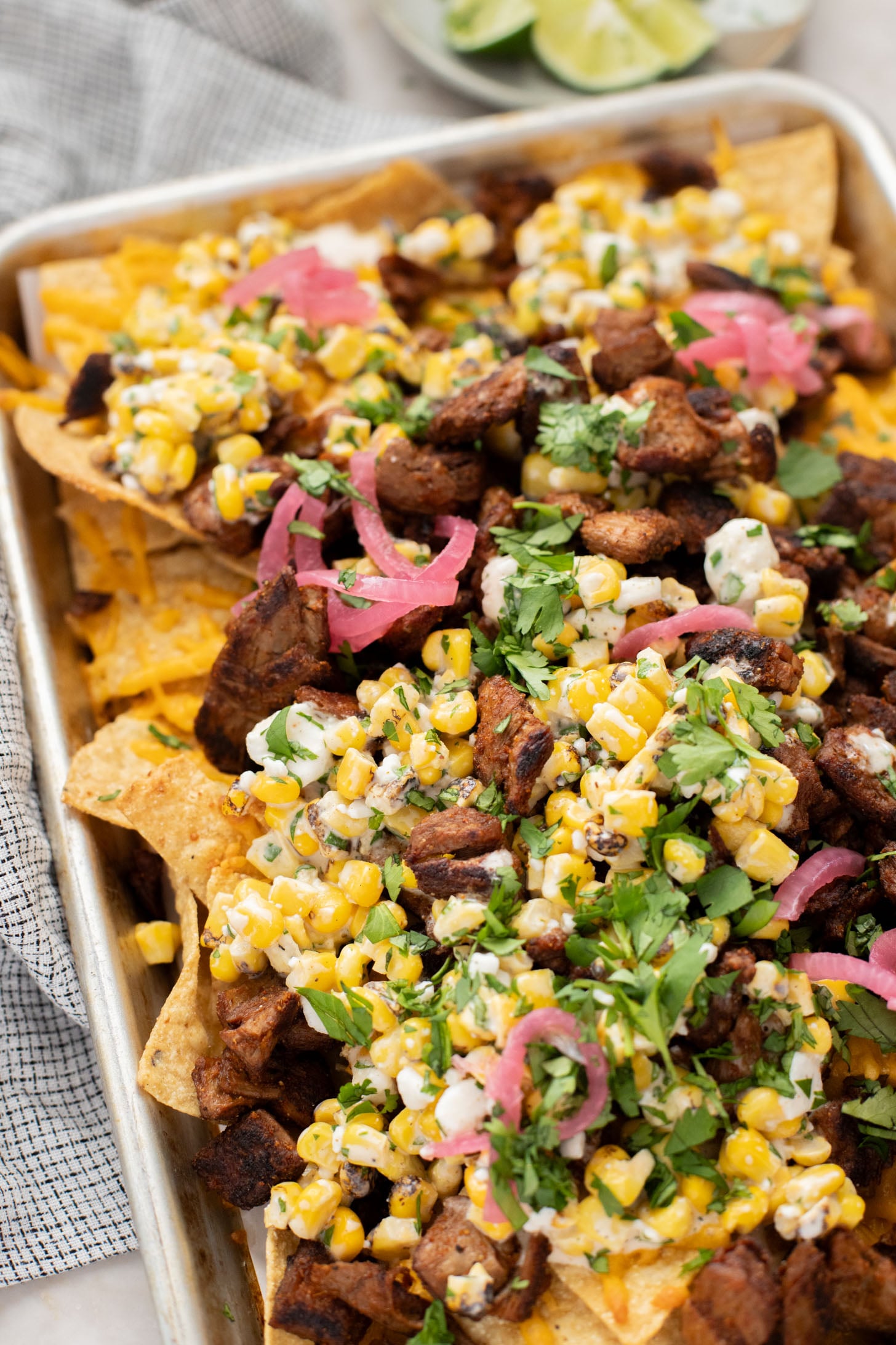 These Vegan Steak Nachos with Elote Salsa are the best game day snack! Ready in less than 30 minutes and perfect for sharing | ThisSavoryVegan.com