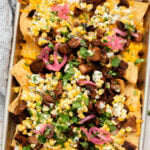 These Vegan Steak Nachos with Elote Salsa are the best game day snack! Ready in less than 30 minutes and perfect for sharing | ThisSavoryVegan.com