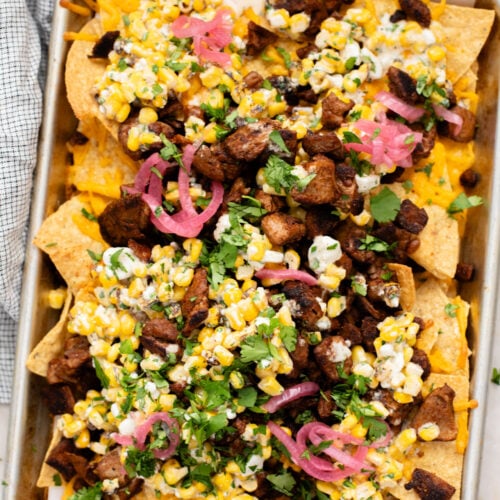 These Vegan Steak Nachos with Elote Salsa are the best game day snack! Ready in less than 30 minutes and perfect for sharing | ThisSavoryVegan.com