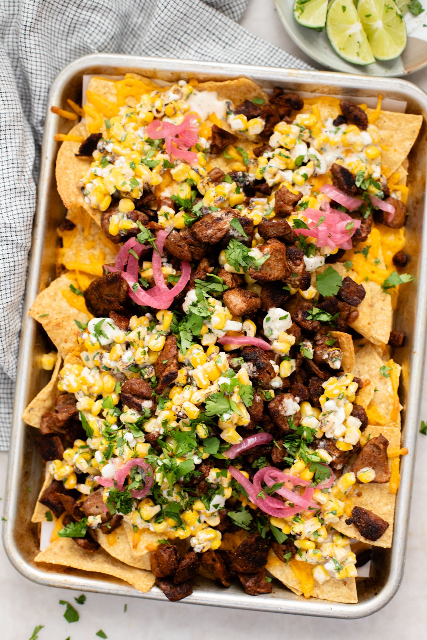 These Vegan Steak Nachos with Elote Salsa are the best game day snack! Ready in less than 30 minutes and perfect for sharing | ThisSavoryVegan.com