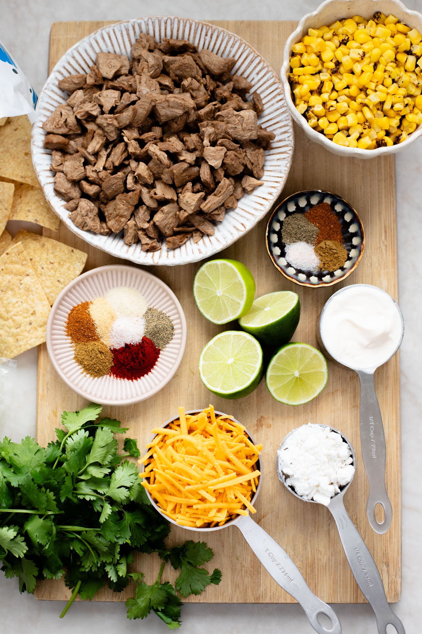 These Vegan Steak Nachos with Elote Salsa are the best game day snack! Ready in less than 30 minutes and perfect for sharing | ThisSavoryVegan.com