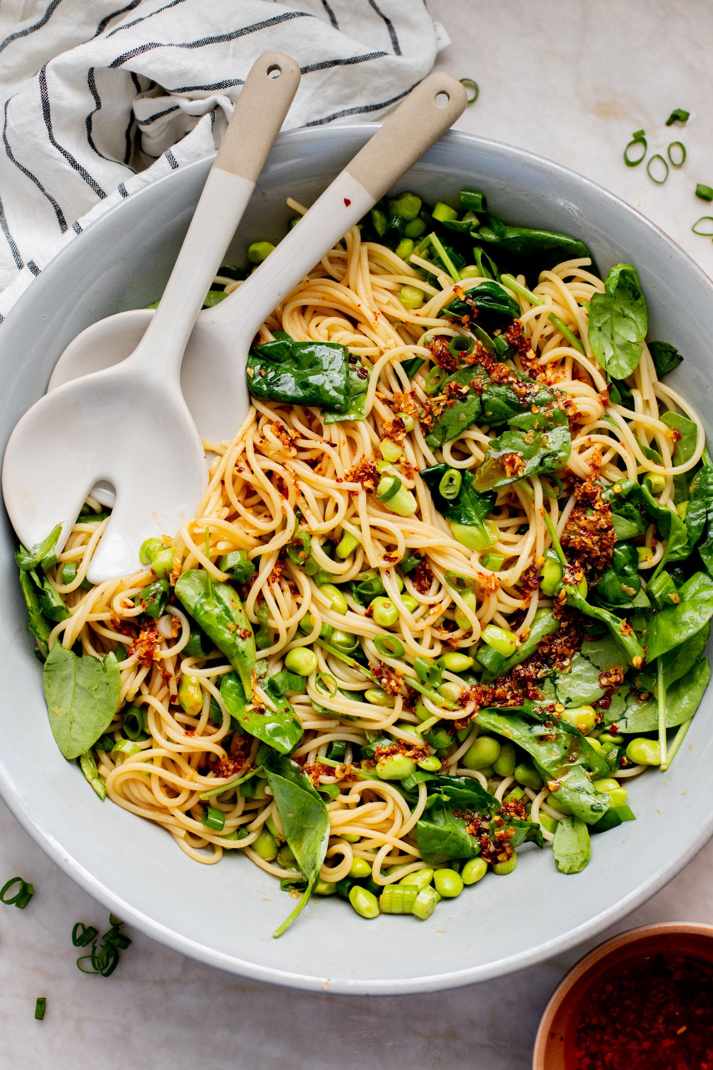 This Cold Edamame Noodle Salad is the perfect dinner when you want something fresh & comforting. Topped with chili crisp for a little heat & packed with plant protein | ThisSavoryVegan.com