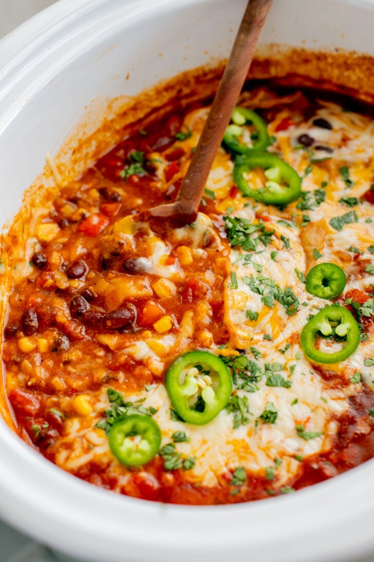 This Slow Cooker Enchilada Casserole is perfect when you want a veggie-packed dinner with minimal effort and without turning on the stove | ThisSavoryVegan.com