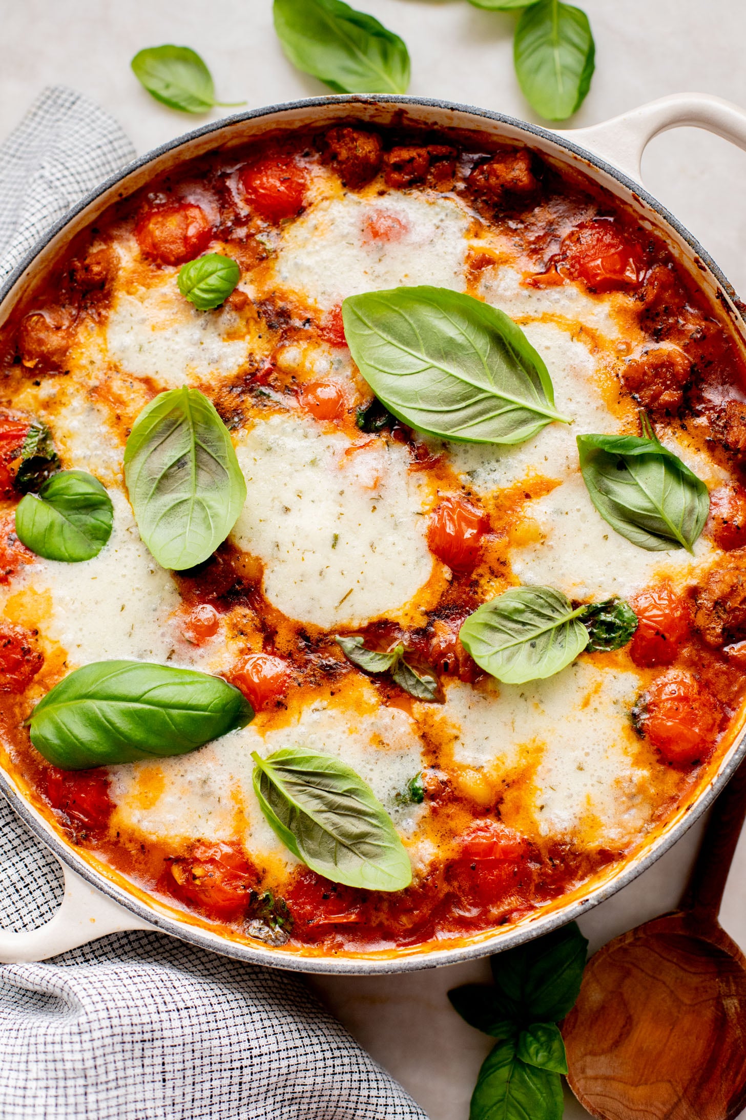 This Soupy Tomato Basil Gnocchi Bake is the perfect soup, that isn't a soup. Gnocchi is baked in a tomato broth and topped with vegan cheese | ThisSavoryVegan.com