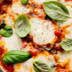 This Soupy Tomato Basil Gnocchi Bake is the perfect soup, that isn't a soup. Gnocchi is baked in a tomato broth and topped with vegan cheese | ThisSavoryVegan.com
