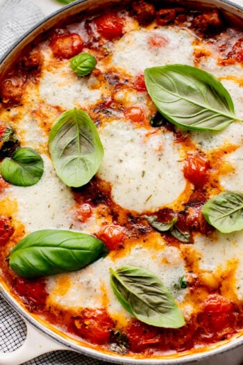 This Soupy Tomato Basil Gnocchi Bake is the perfect soup, that isn't a soup. Gnocchi is baked in a tomato broth and topped with vegan cheese | ThisSavoryVegan.com
