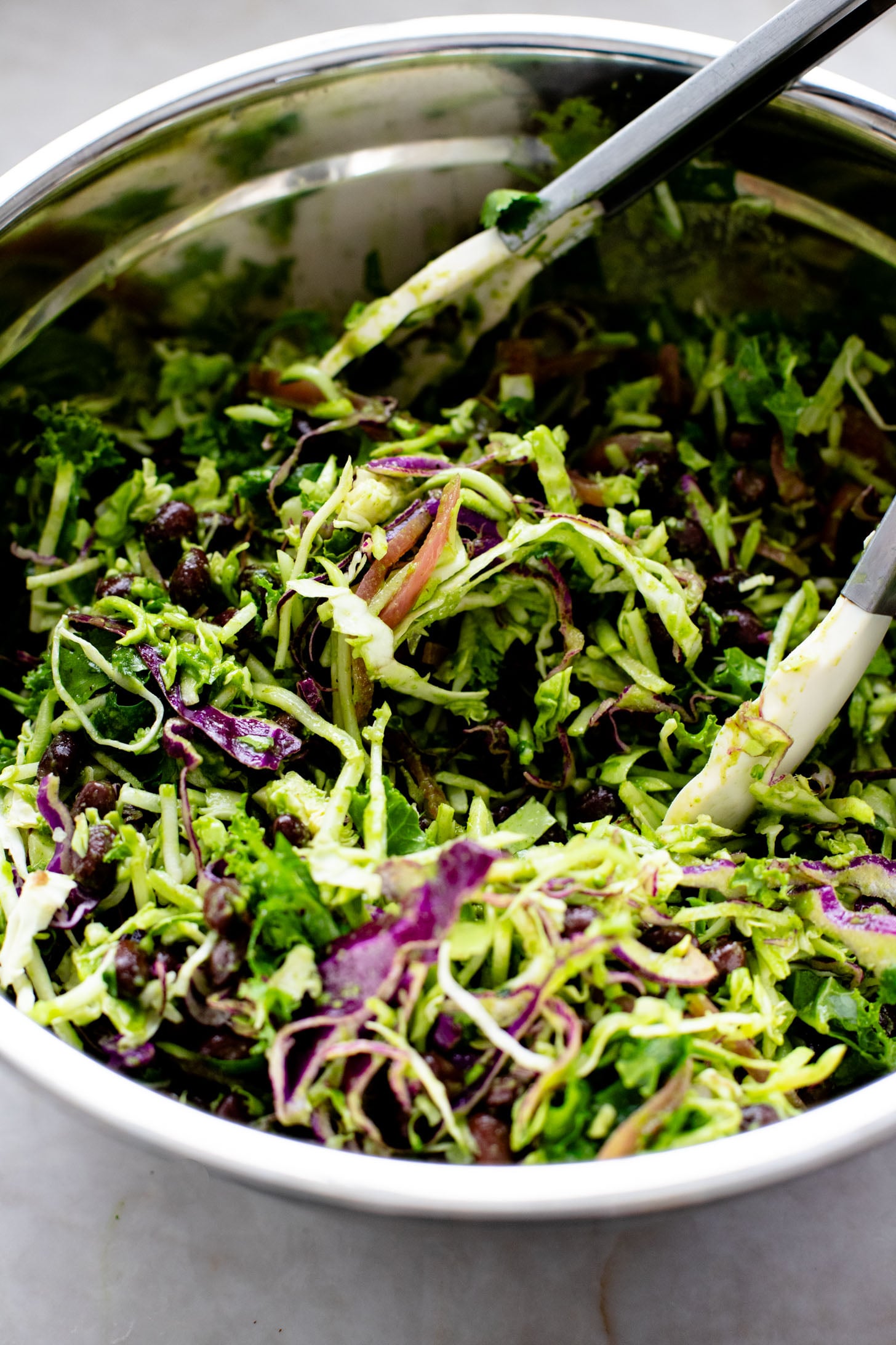 This Trader Joe's Black Bean Crunch Salad is a flavor bomb. Crisp kale slaw, black beans, crunchy jalapeños, pickled onions & a delicious cilantro lime dressing | ThisSavoryVegan.com