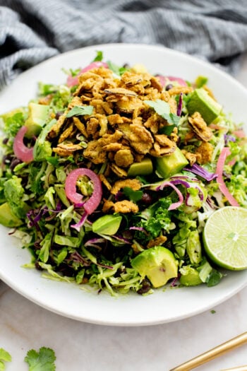 This Trader Joe's Black Bean Crunch Salad is a flavor bomb. Crisp kale slaw, black beans, crunchy jalapeños, pickled onions & a delicious cilantro lime dressing | ThisSavoryVegan.com