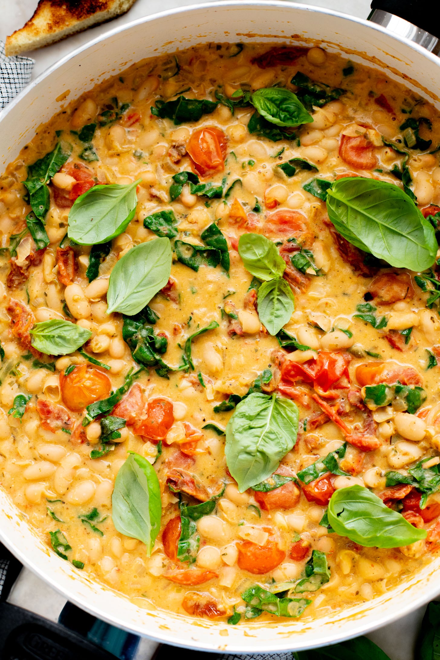 This Tuscan White Bean Skillet is an easy weeknight dinner that is dairy-free and super comforting - the whole family will love it | ThisSavoryVegan.com