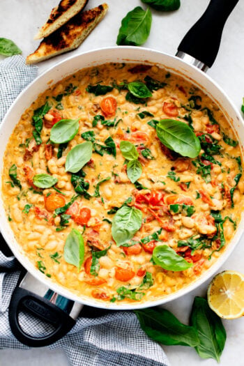 This Tuscan White Bean Skillet is an easy weeknight dinner that is dairy-free and super comforting - the whole family will love it | ThisSavoryVegan.com