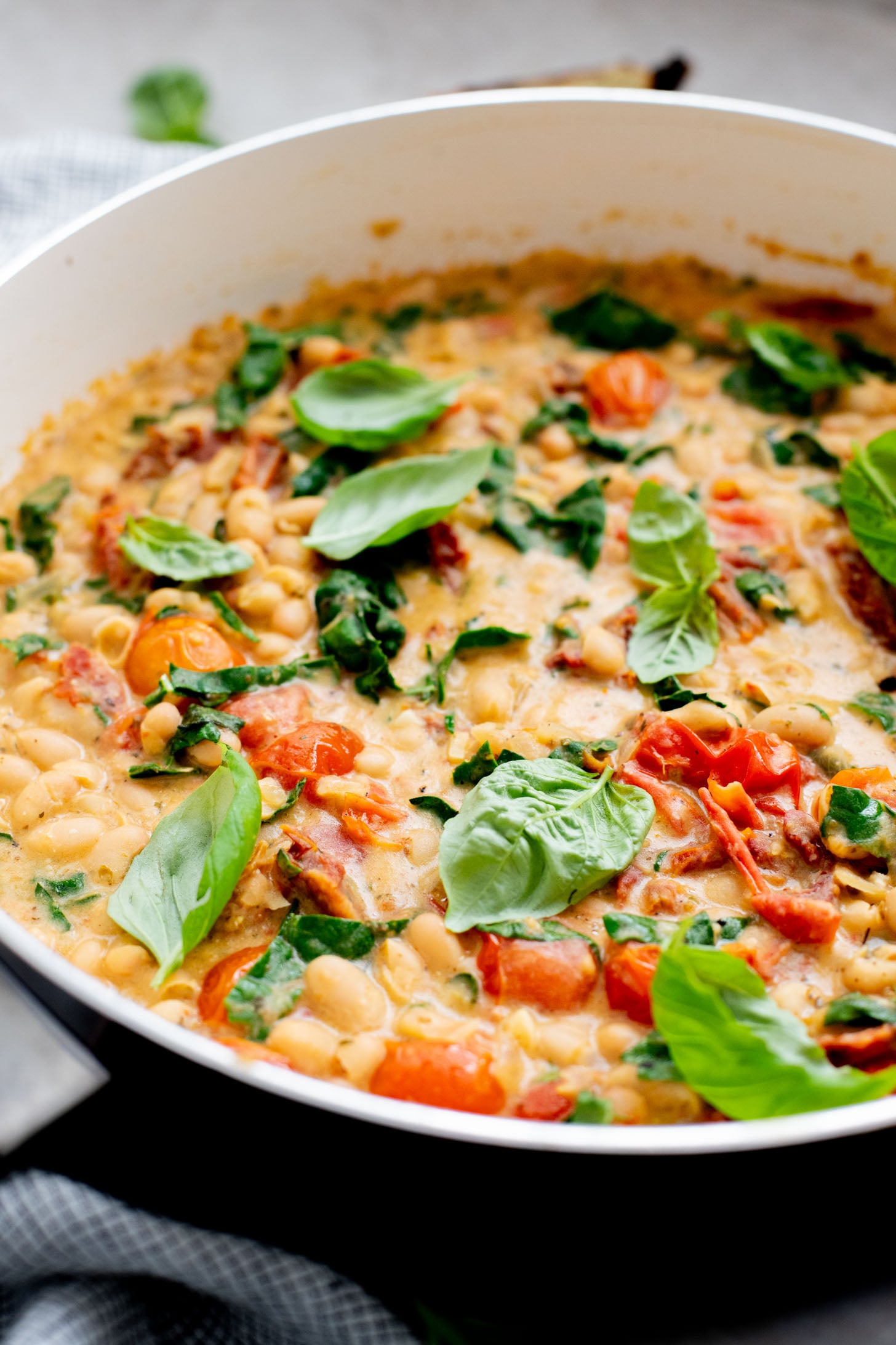 This Tuscan White Bean Skillet is an easy weeknight dinner that is dairy-free and super comforting - the whole family will love it | ThisSavoryVegan.com
