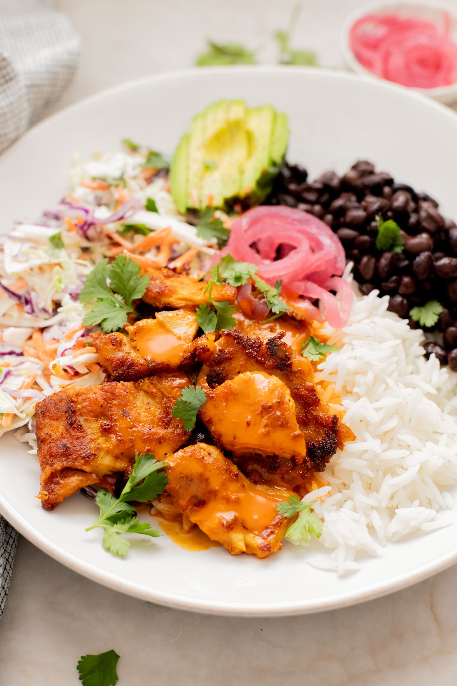 These Vegan Buffalo Chicken Plates are the perfect dinner - crispy buffalo "chicken" is loaded up with rice, beans & a dairy-free slaw | ThisSavoryVegan.com