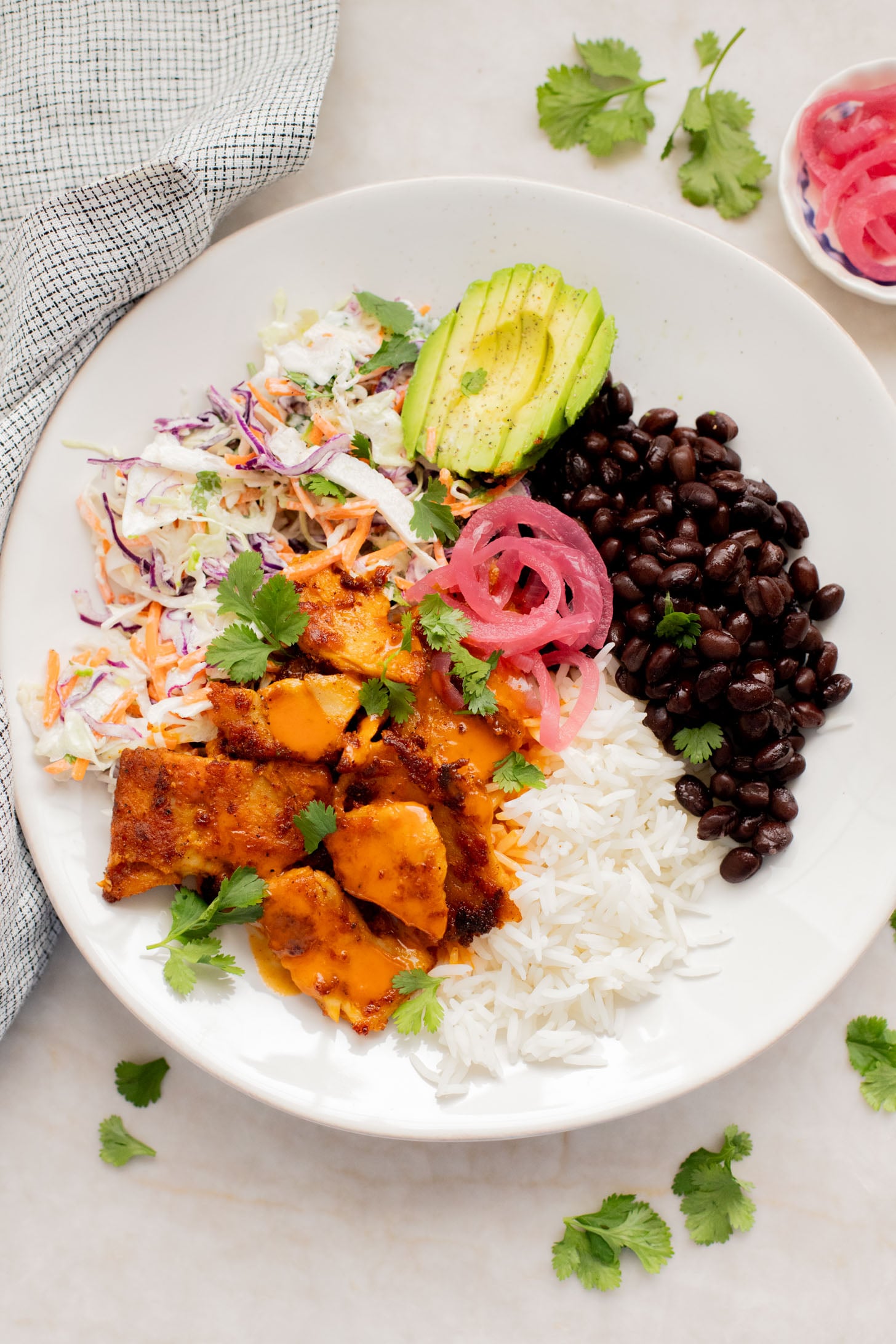 These Vegan Buffalo Chicken Plates are the perfect dinner - crispy buffalo "chicken" is loaded up with rice, beans & a dairy-free slaw | ThisSavoryVegan.com