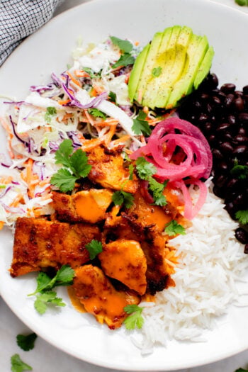 These Vegan Buffalo Chicken Plates are the perfect dinner - crispy buffalo "chicken" is loaded up with rice, beans & a dairy-free slaw | ThisSavoryVegan.com