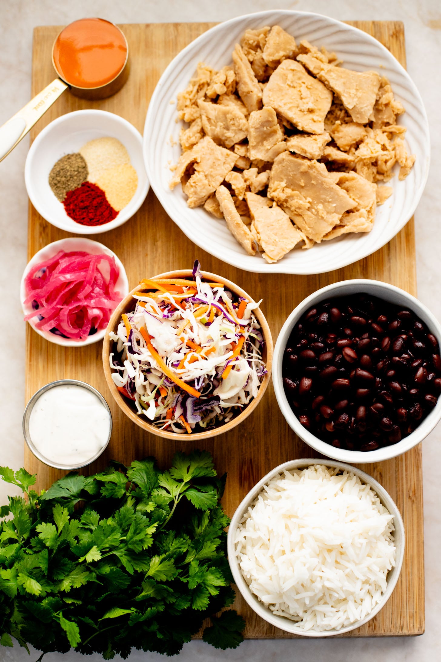 These Vegan Buffalo Chicken Plates are the perfect dinner - crispy buffalo "chicken" is loaded up with rice, beans & a dairy-free slaw | ThisSavoryVegan.com
