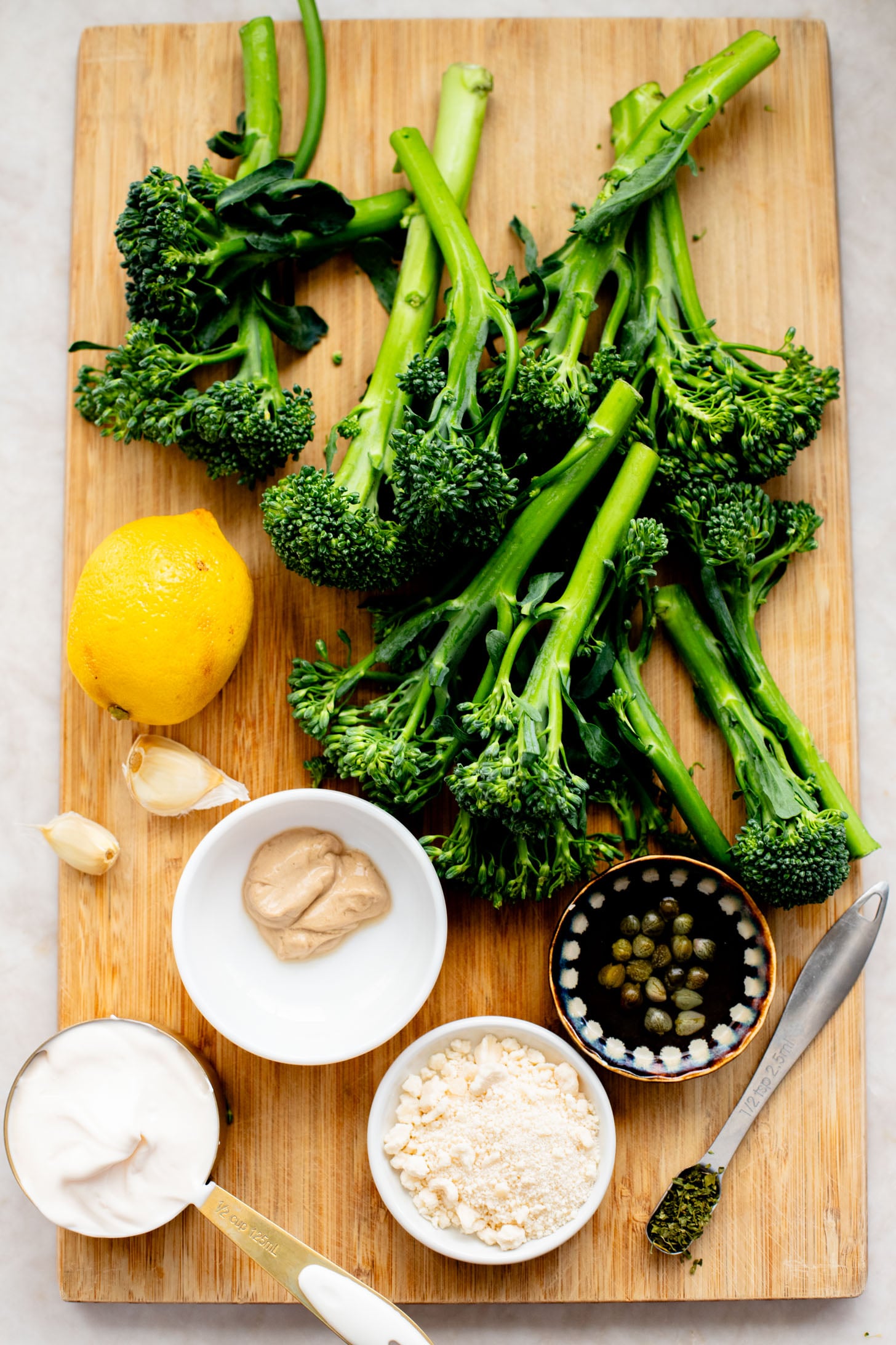This Charred Broccolini Caesar Salad is a vegan dream - a creamy, dairy-free Caesar dressing, oven-roasted broccolini & garlic croutons | ThisSavoryVegan.com