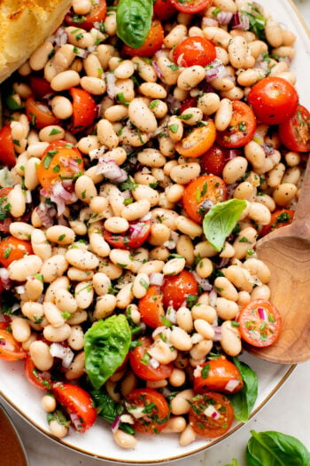 This Herby White Bean Salad is a simple, protein-packed dense bean salad that doesn't skimp on flavor. Perfect for meal prep | ThisSavoryVegan.com