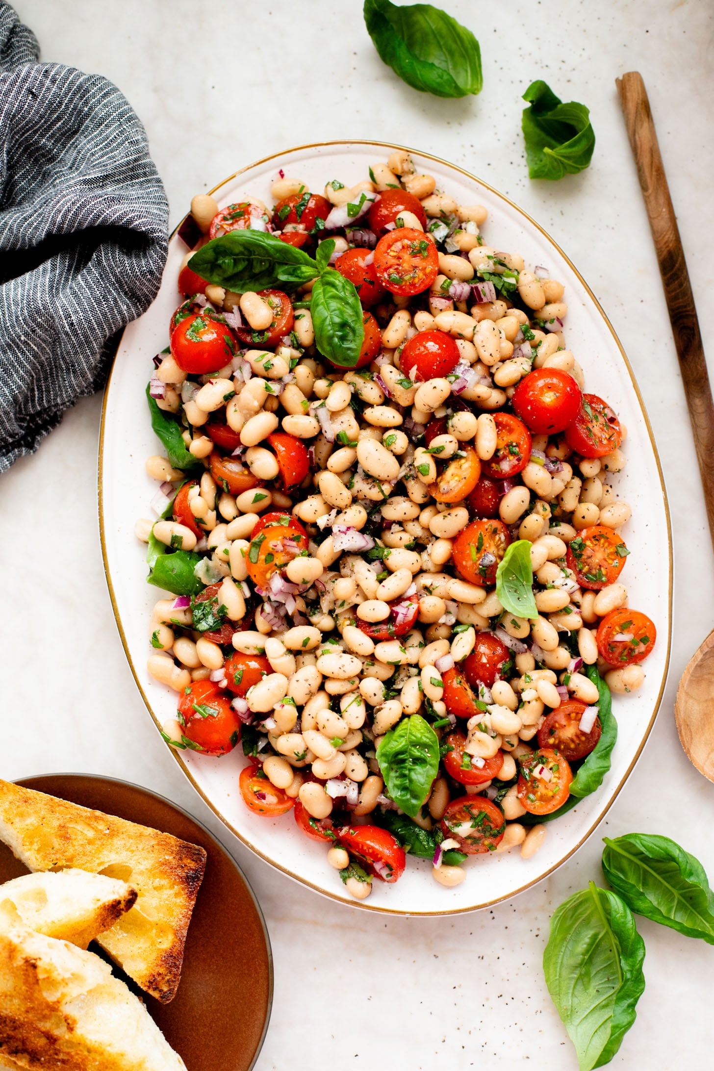 This Herby White Bean Salad is a simple, protein-packed dense bean salad that doesn't skimp on flavor. Perfect for meal prep | ThisSavoryVegan.com