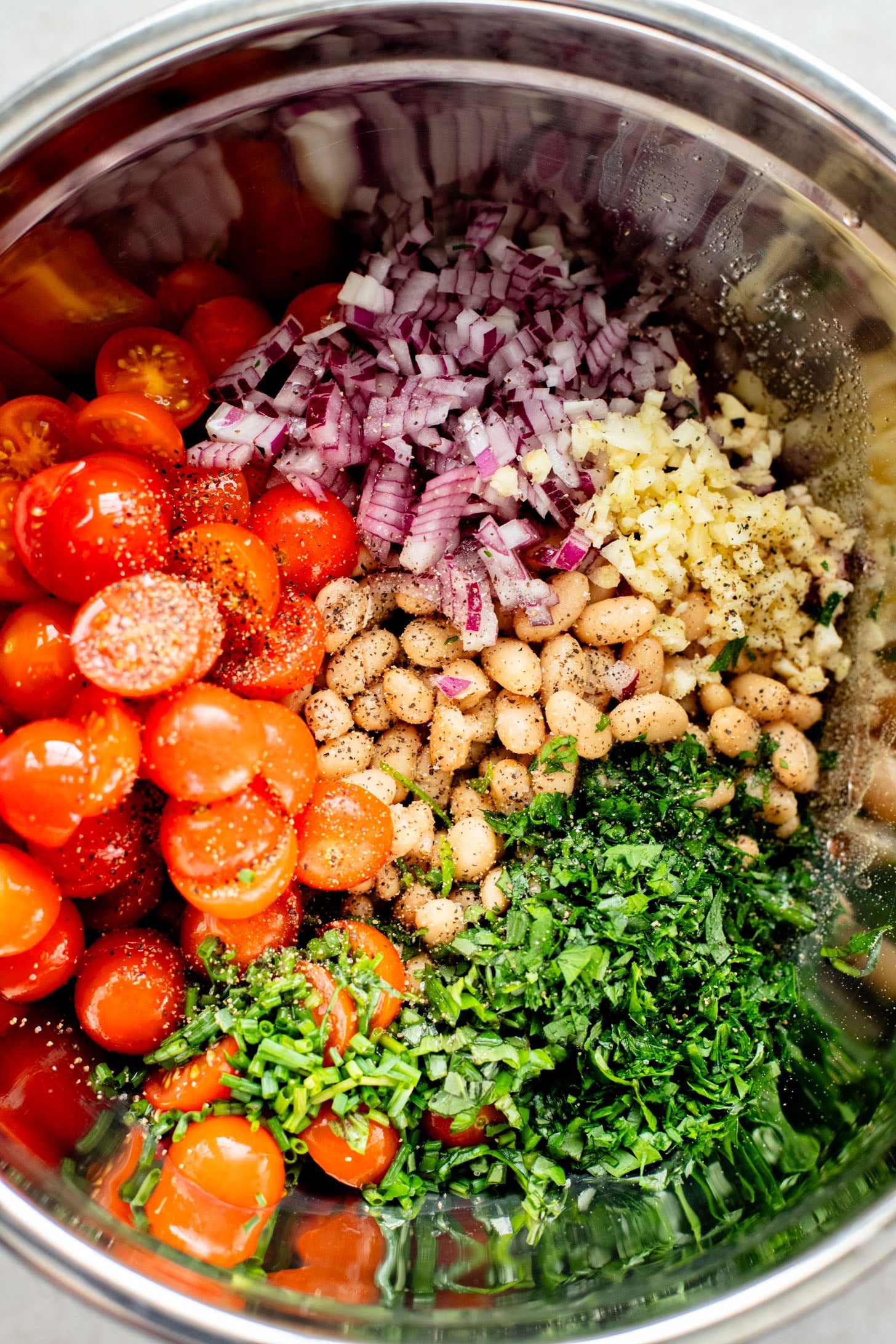 This Herby White Bean Salad is a simple, protein-packed dense bean salad that doesn't skimp on flavor. Perfect for meal prep | ThisSavoryVegan.com
