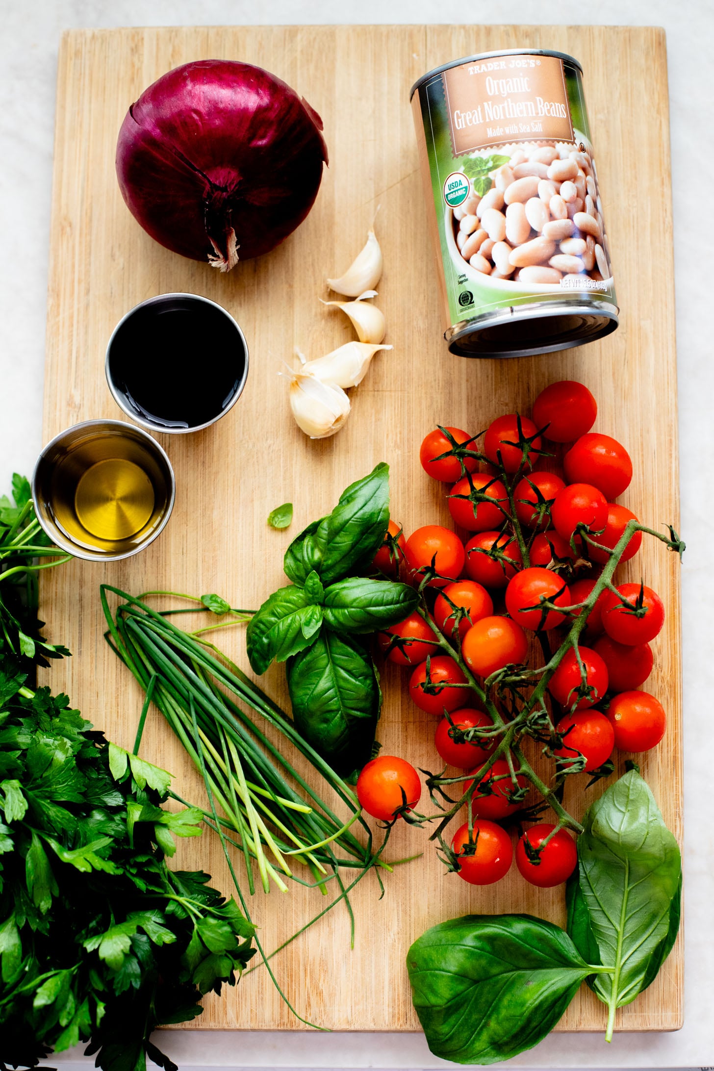 This Herby White Bean Salad is a simple, protein-packed dense bean salad that doesn't skimp on flavor. Perfect for meal prep | ThisSavoryVegan.com