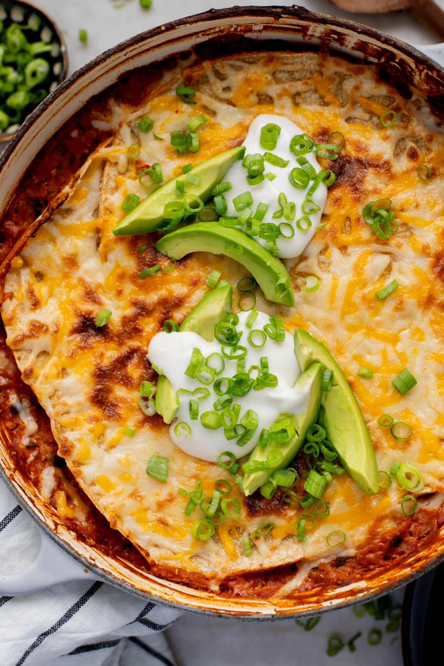 This High Protein Quinoa Enchilada Casserole is perfect for meal prep! Everything is cooked in one pot and each serving has 20+ grams of plant protein | ThisSavoryVegan.com